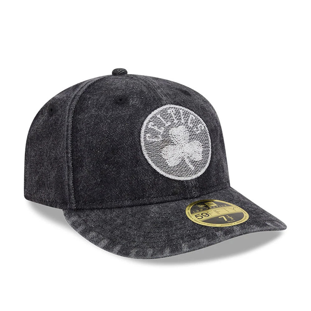 Boston Celtics NBA 59FIFTY Day Black Low Profile New Era 59FIFTY Fitted Cap, three-quarter view showing a white embroidered Celtics logo with a shamrock on the front panel, black textured fabric, and gold 59FIFTY size sticker on the flat visor.