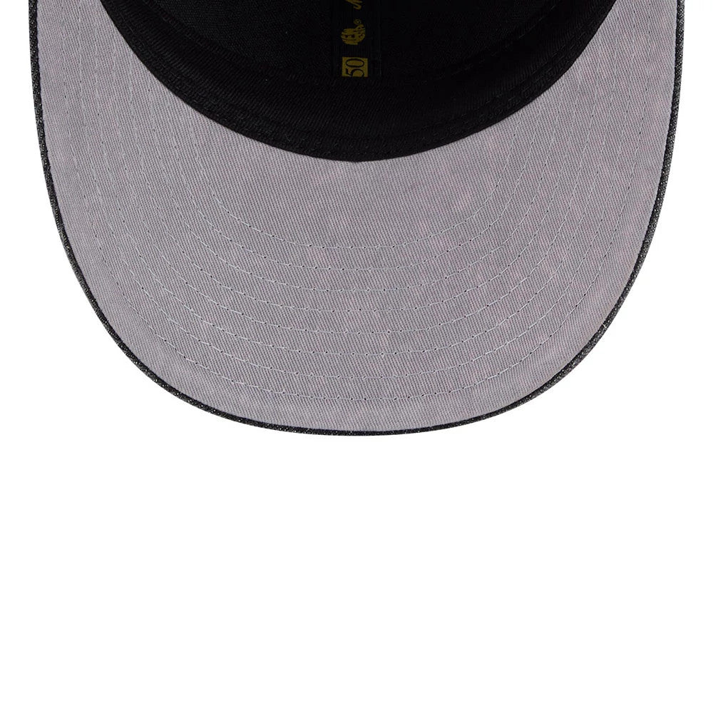 Boston Celtics NBA 59FIFTY Day Black Low Profile New Era 59FIFTY Fitted Cap, inside view showing the grey undervisor with multiple stitched lines, a black sweatband, and gold taping with logos along the interior seam.