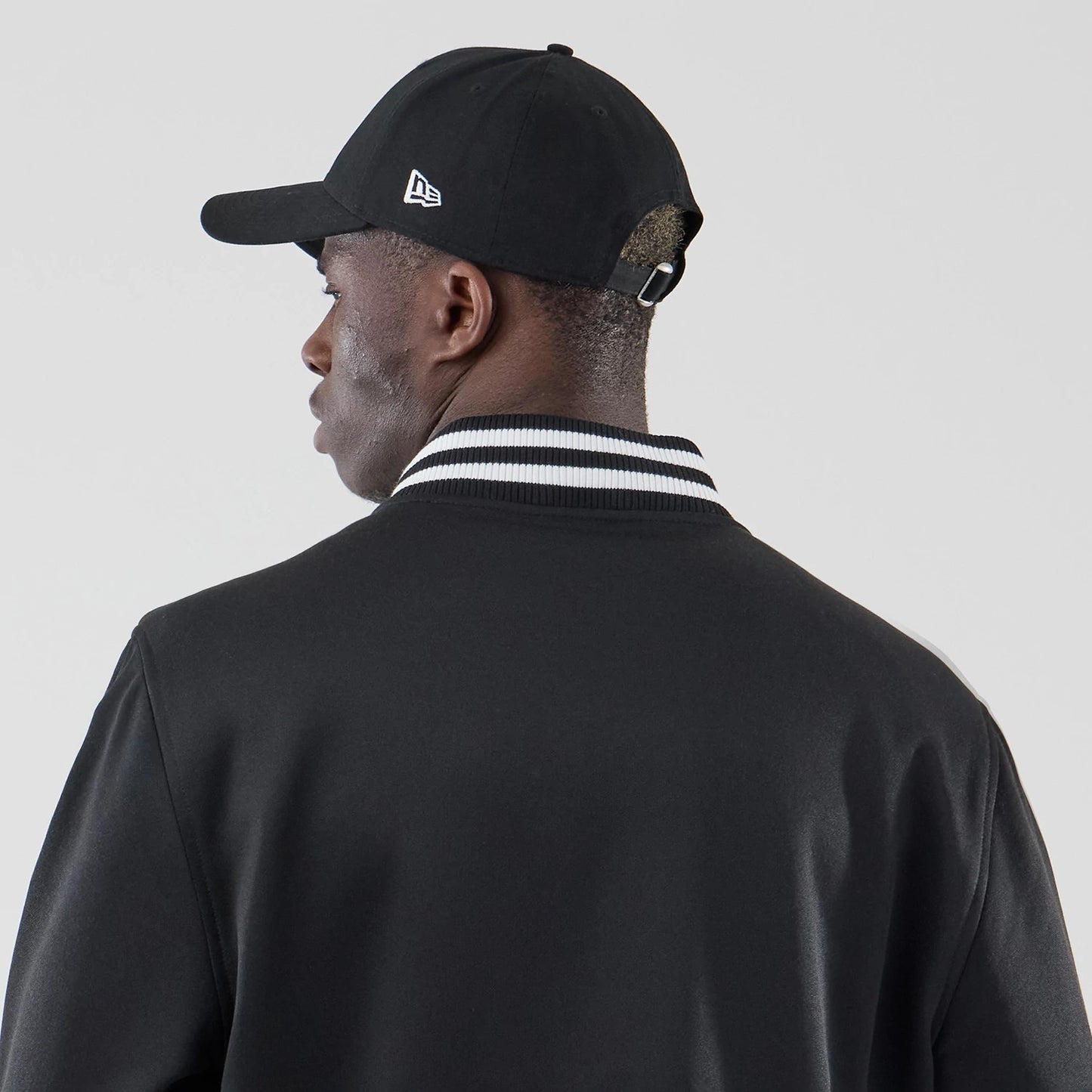 The model is wearing this MLB Jersey Bomber Detroit Tigers Jacket in black. 7
