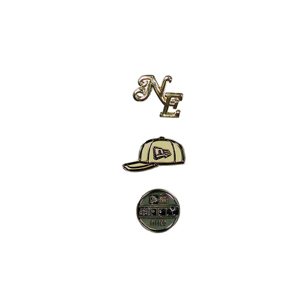 New Era 59FIFTY Day 3 Pack Black Pin Badge, front view displaying a trio of distinctive enamel pins, featuring an intricate NE script design, an outlined baseball cap with a logo on the front panel, and a circular badge stating 59FIFTY Fitted.