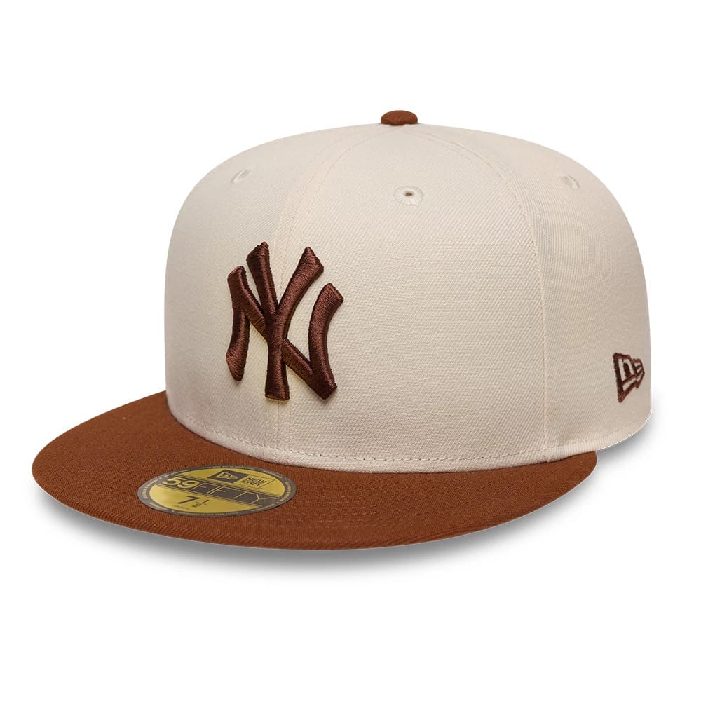 Pictured is this MLB League Essential New York Yankees 59FIFTY Fitted cap in cream. 1