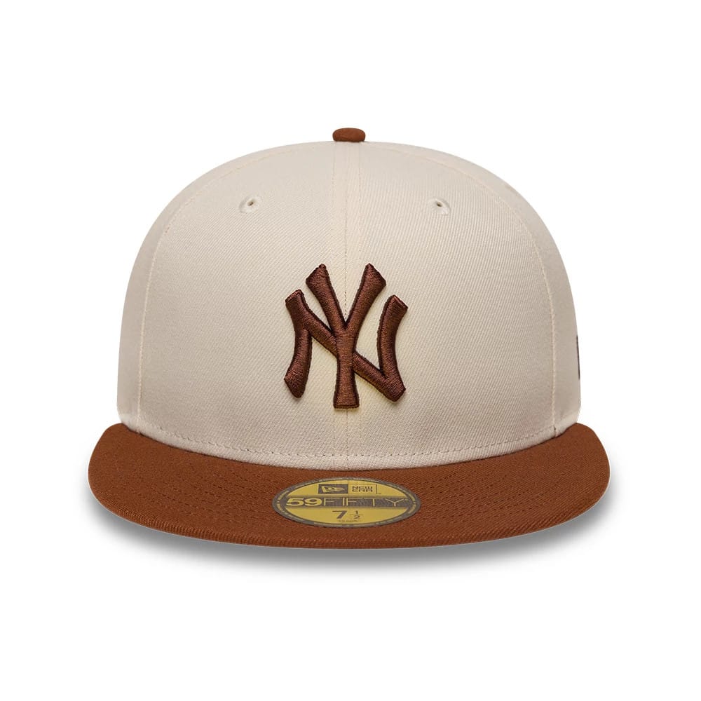 Pictured is this MLB League Essential New York Yankees 59FIFTY Fitted cap in cream. 2