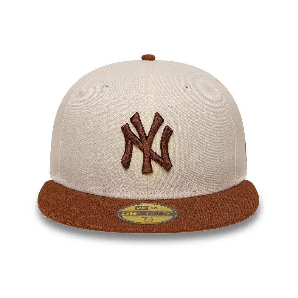 New York Yankees MLB League Essential Cream & Brown New Era 59FIFTY Fitted Cap, front view showing the brown embroidered NY logo on the cream front panel, brown flat visor with a gold 59FIFTY size sticker, and matching top button.