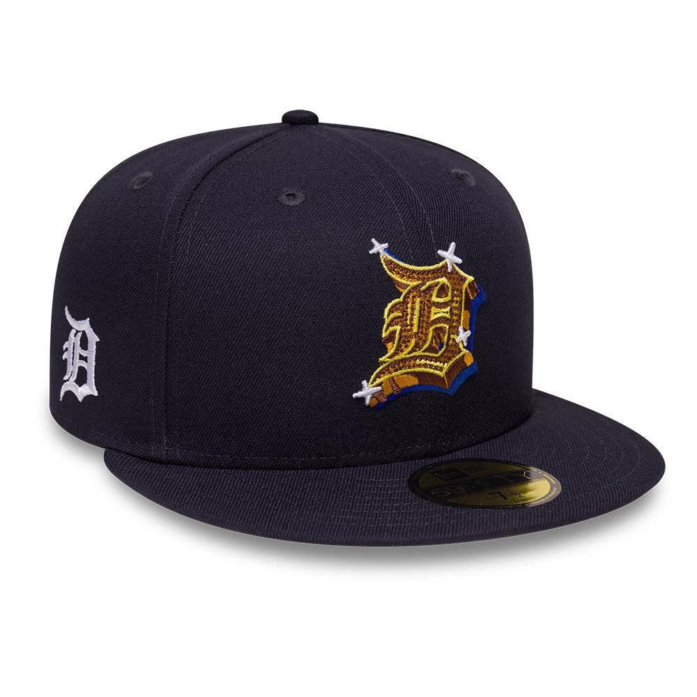 Detroit Tigers MLB Emblem Navy New Era 59FIFTY Fitted Cap, front view showing a prominently embroidered gold and brown emblem on the front panel, a white D logo on the left side, and a gold 59FIFTY size sticker on the flat visor.