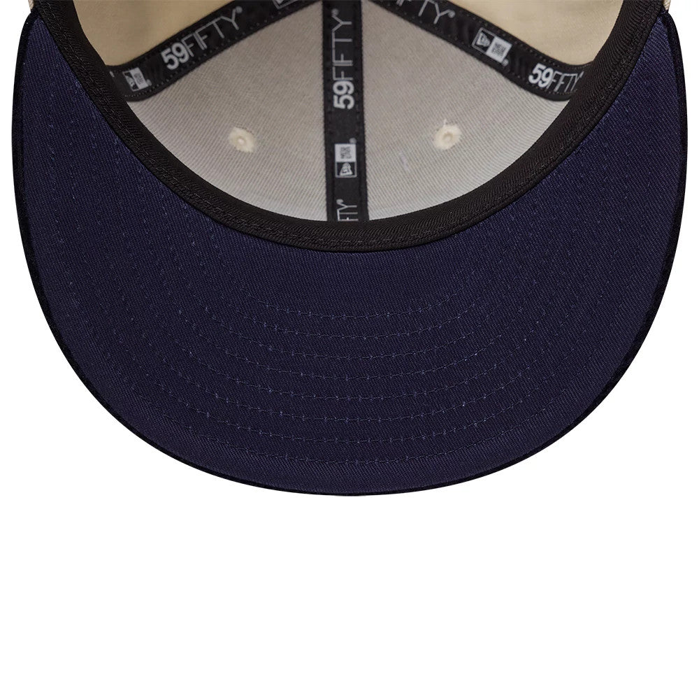 New Era Patch Cord Cream & Black 59FIFTY Fitted Cap, inside view showing the white taping with frequent 59FIFTY logos, beige sweatband, black undervisor, and two cream-coloured eyelets on the structured inner crown.