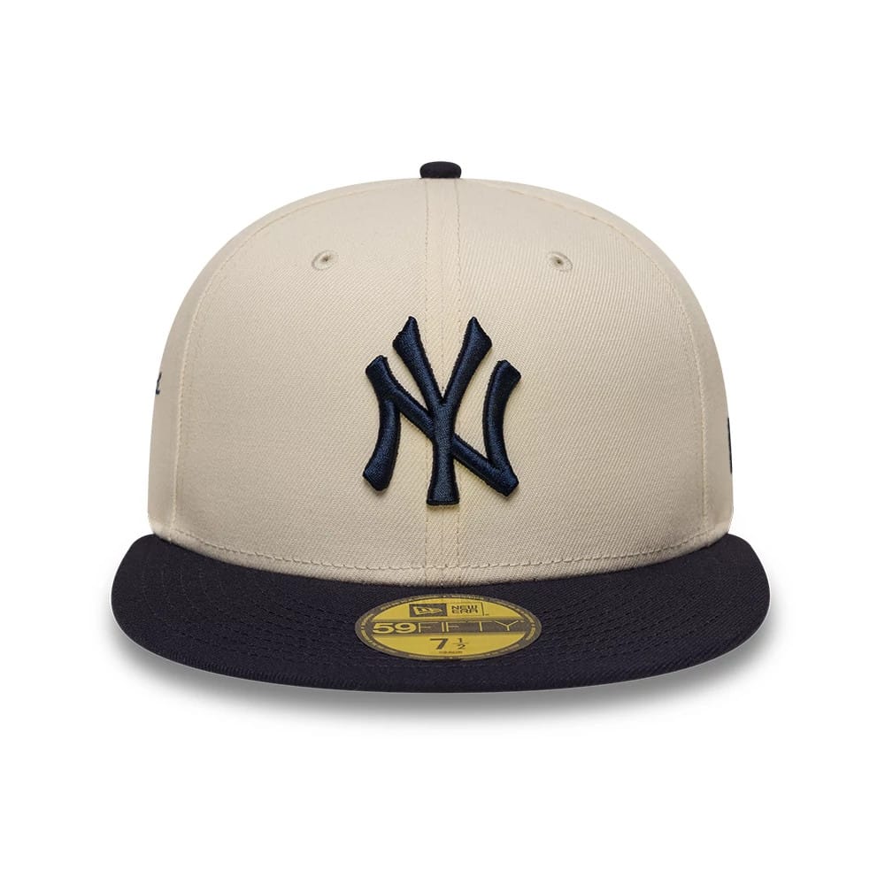Pictured is this MLB Side Script New York Yankees 59FIFTY Fitted cap in cream & navy. 2