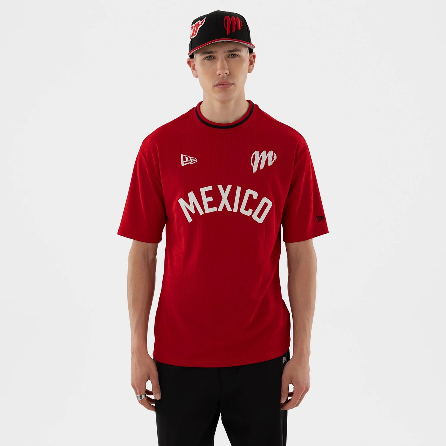 The model is wearing this LMB Mexico Diablos Oversized T-Shirt in red. 1