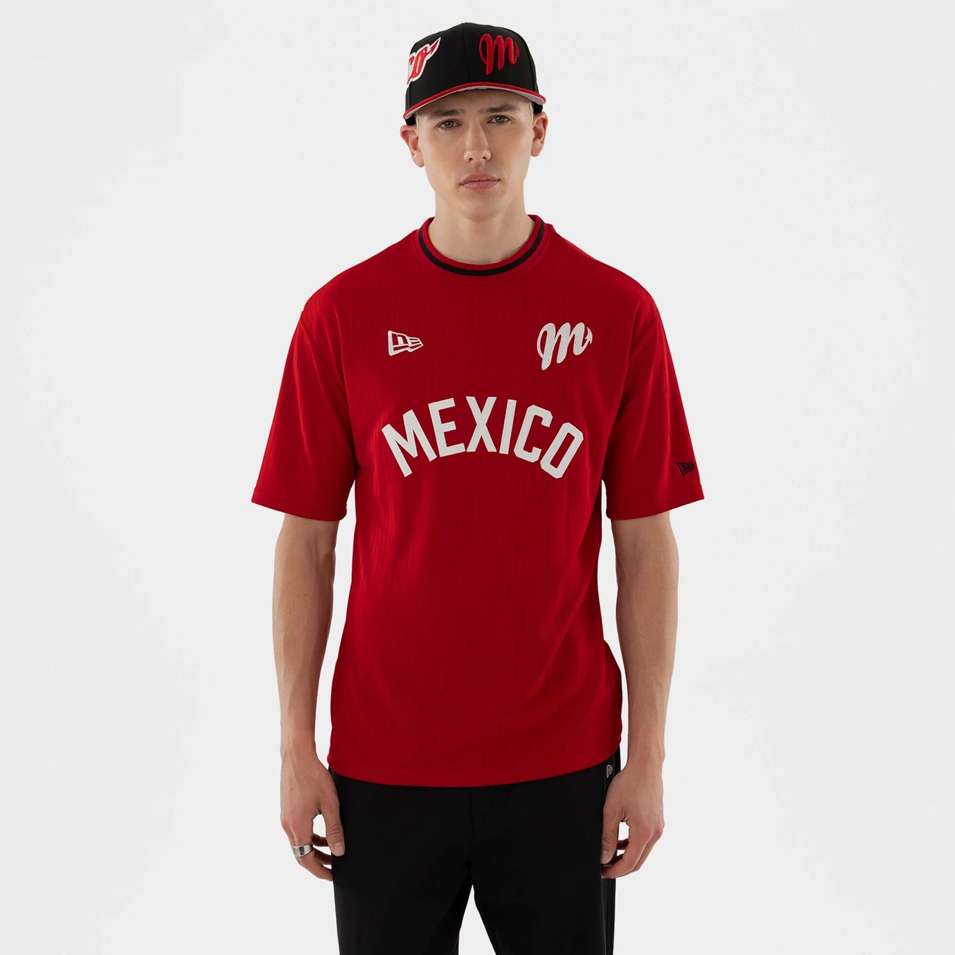 The model is wearing this LMB Mexico Diablos T-Shirt in red. 1