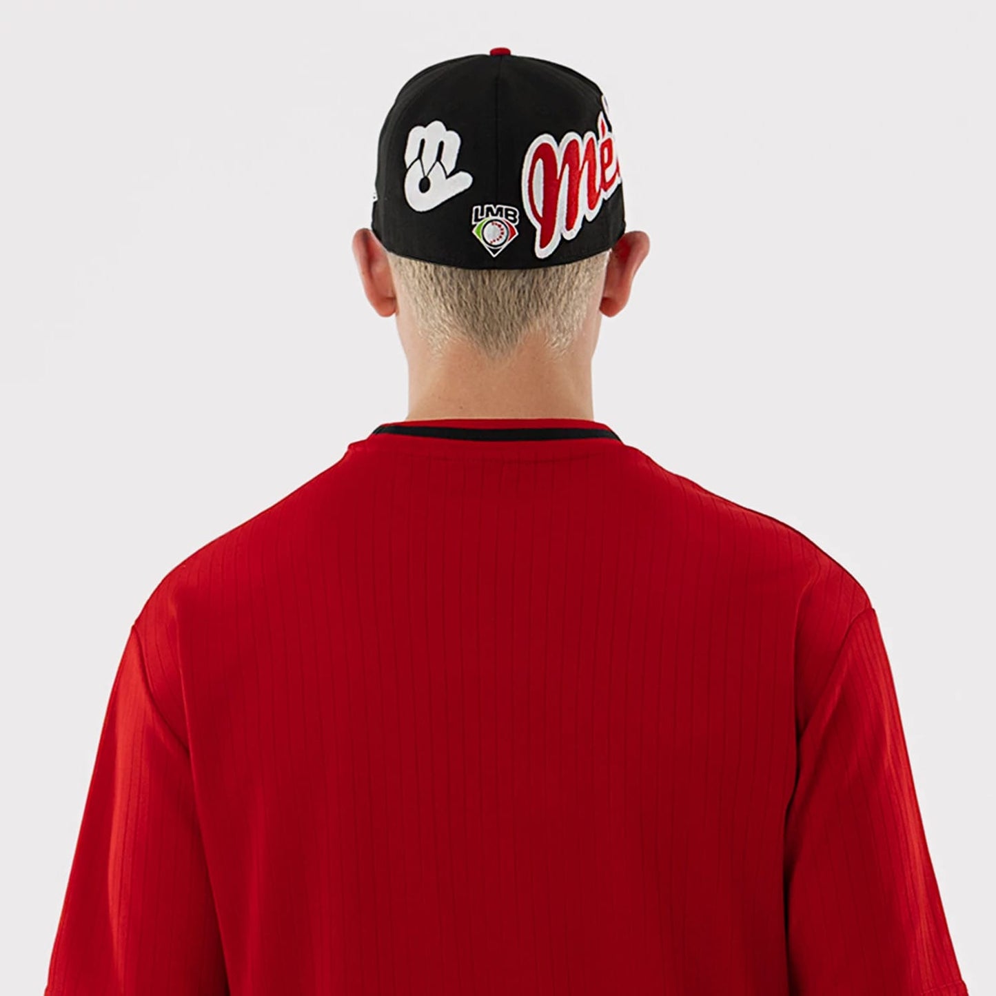 The model is wearing this LMB Mexico Diablos Oversized T-Shirt in red. 7
