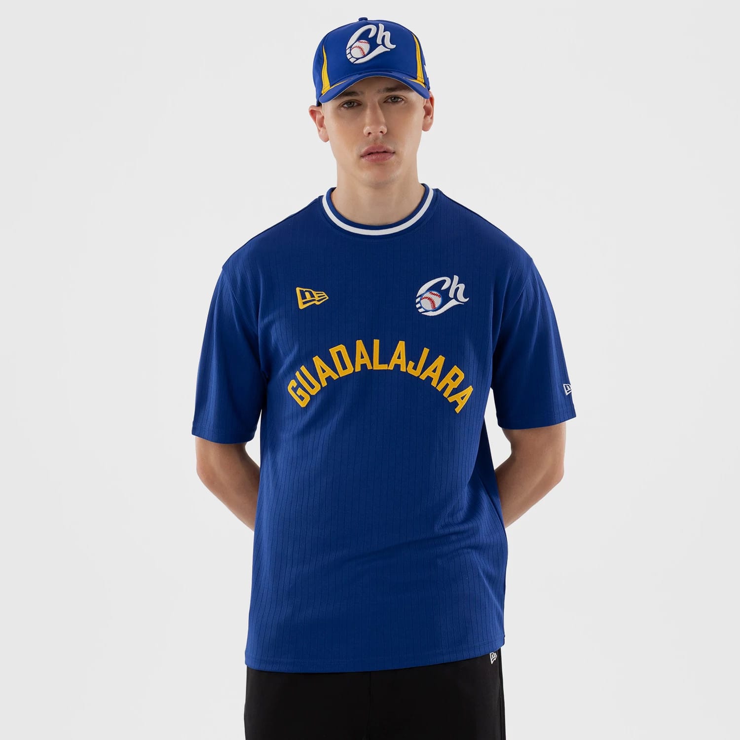 The model is wearing this LMB Charros De Jalisco Oversized T-Shirt in blue. 1