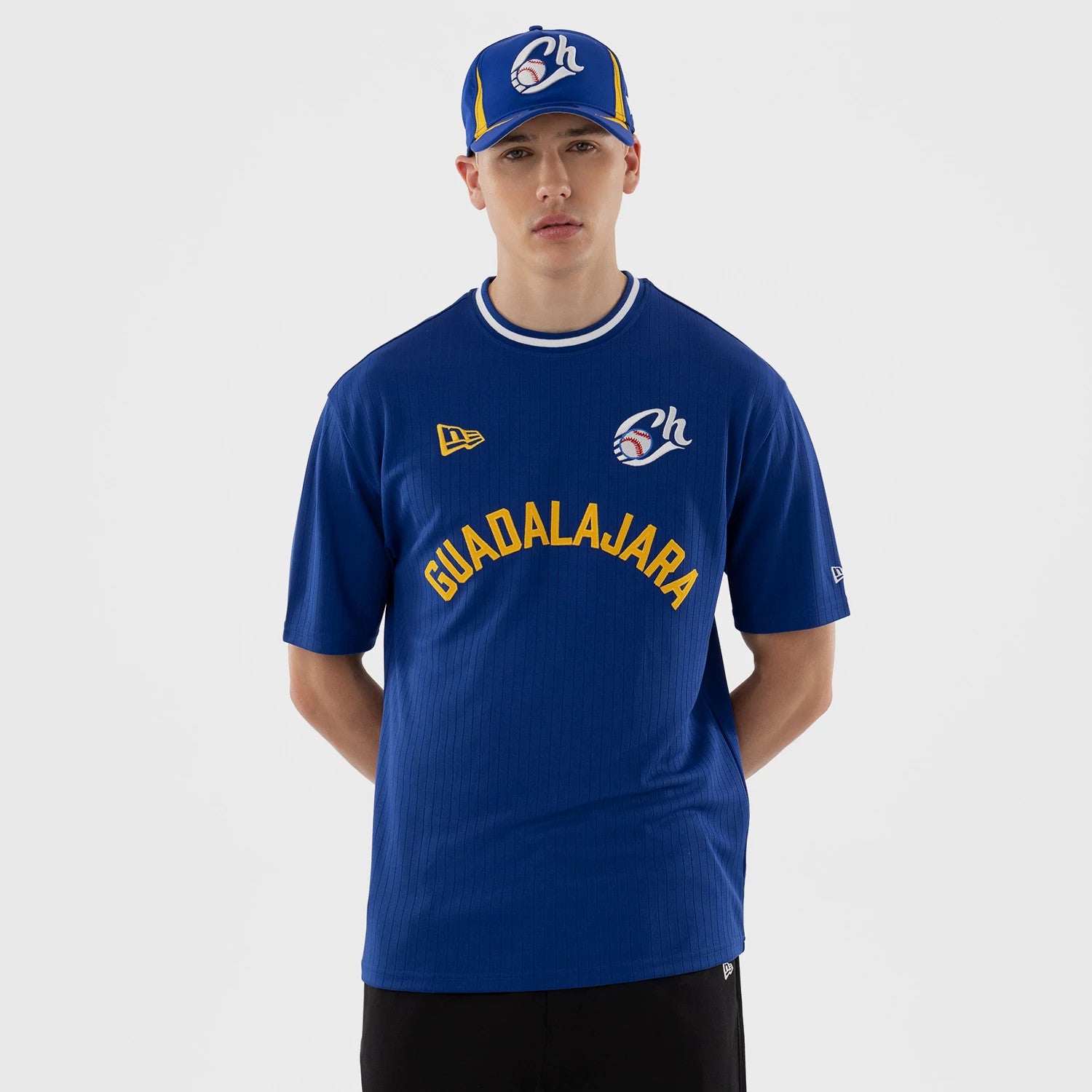 The model is wearing this LMB Charros De Jalisco Oversized T-Shirt in blue. 1