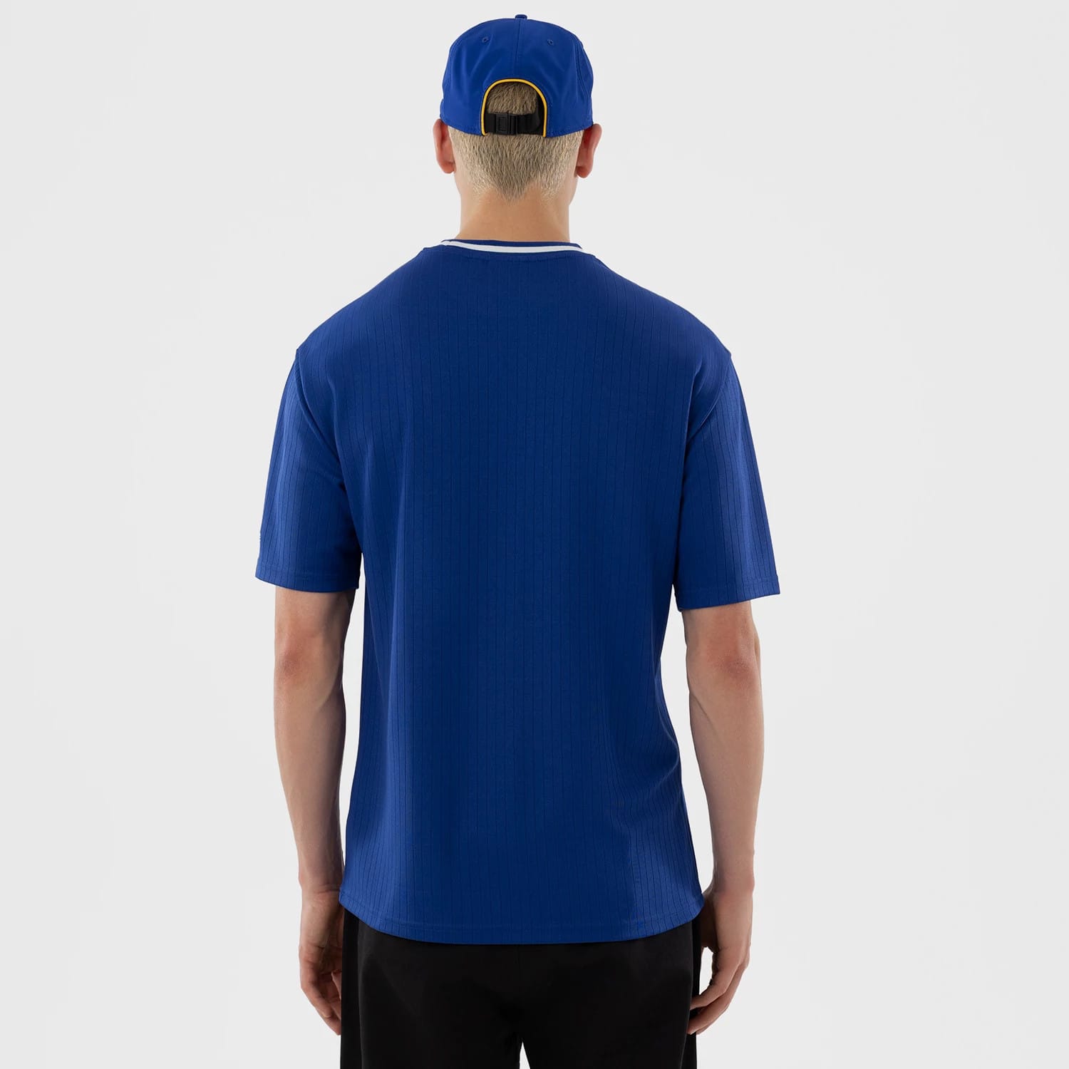 The model is wearing this LMB Charros De Jalisco Oversized T-Shirt in blue. 2