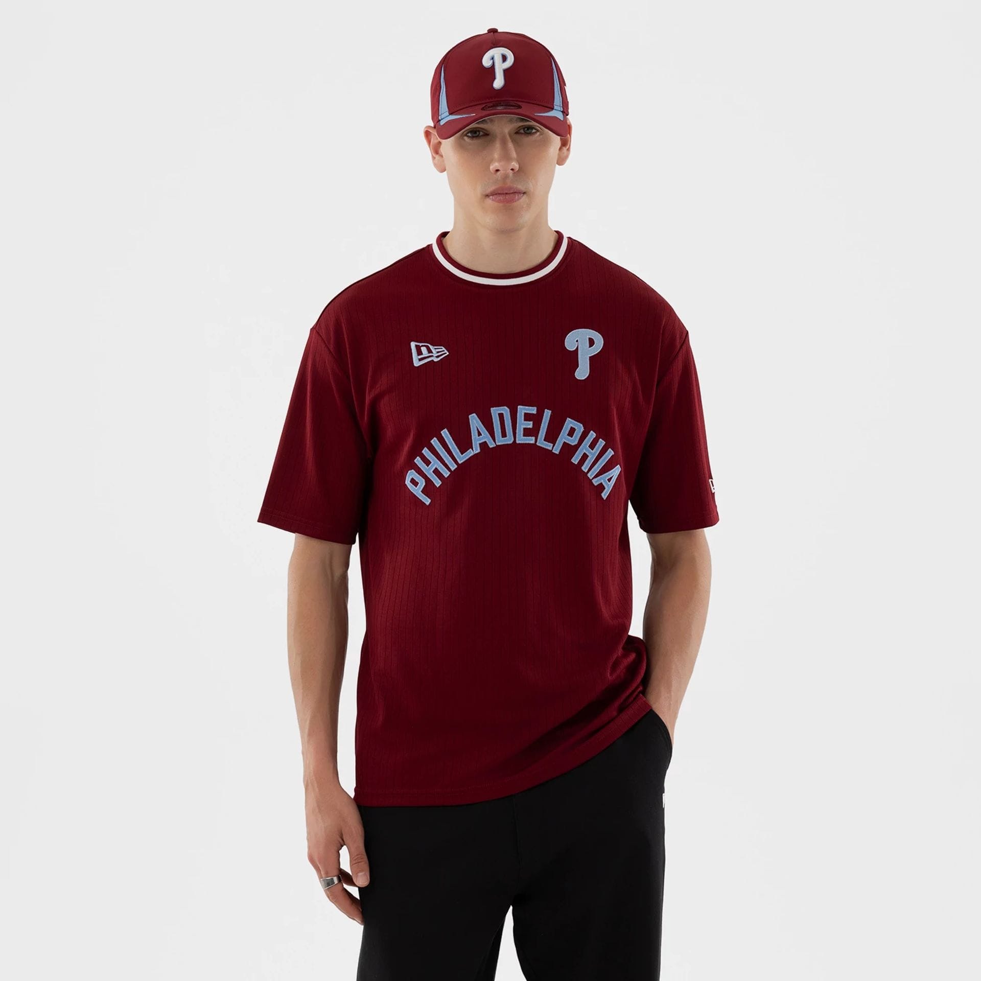 The model is wearing this MLB Philadelphia Phillies T-Shirt in dark red. 1