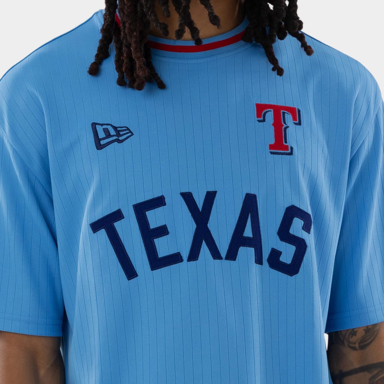 The model is wearing this MLB Texas Rangers Oversized T-Shirt in pastel blue. 4