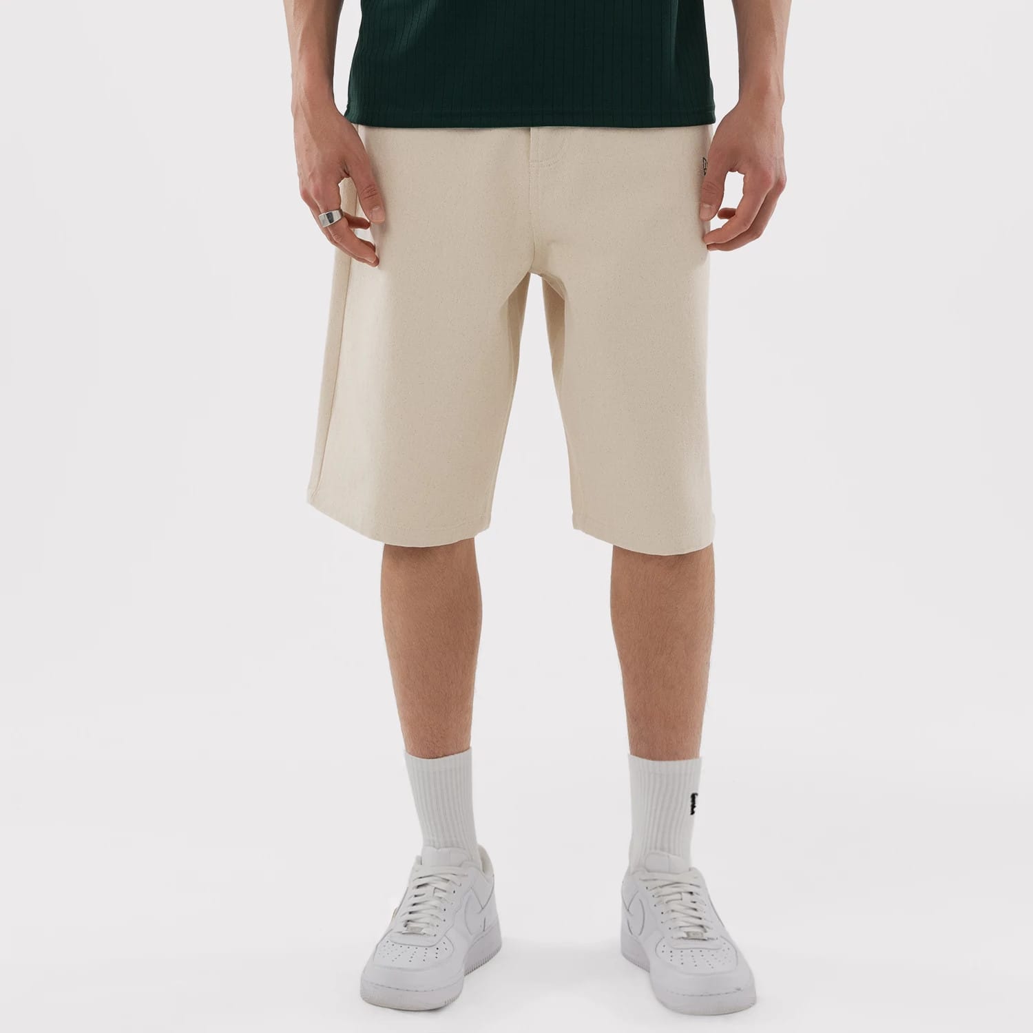 The model is wearing this MLB Jort Athletics Oversized Shorts in Cream. 1