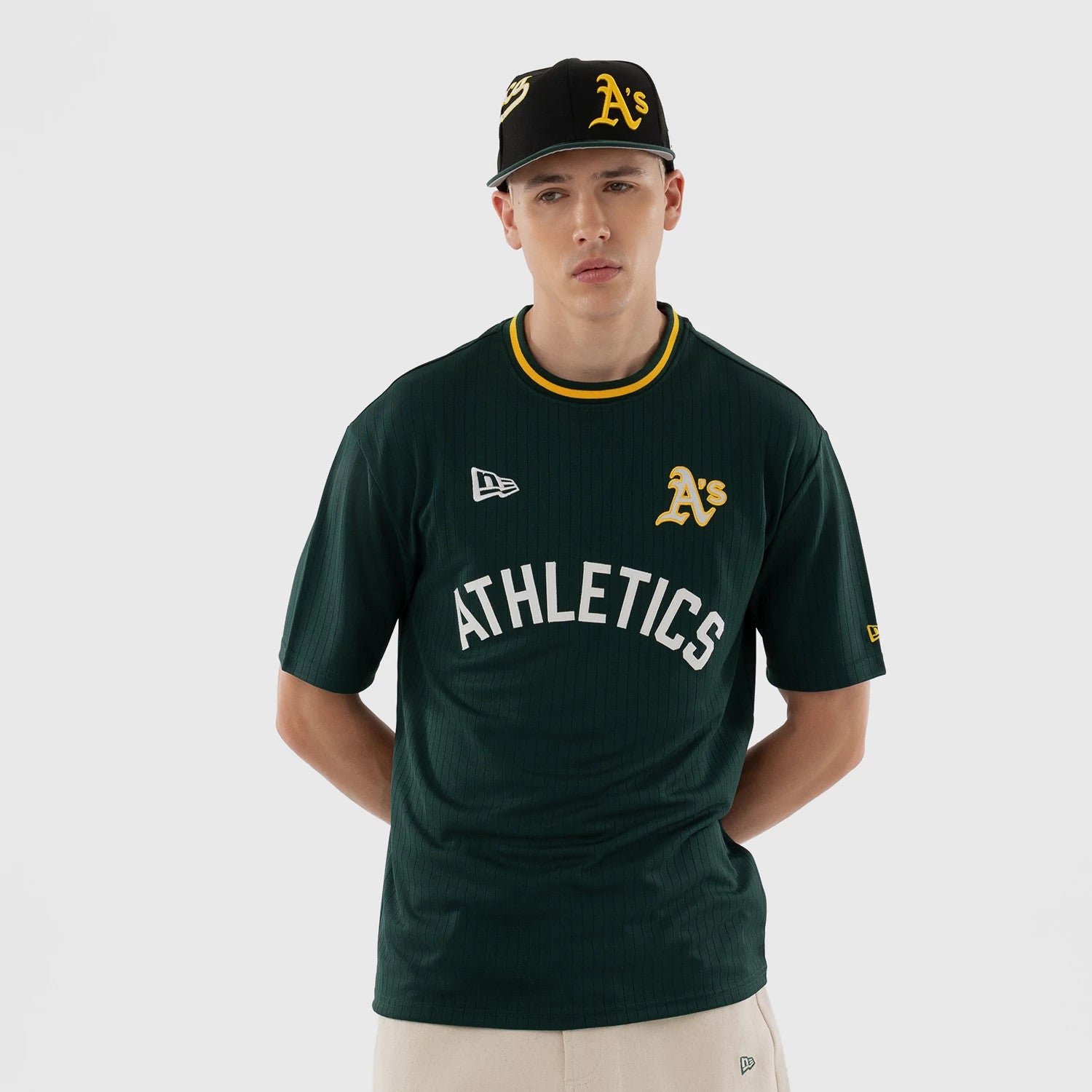 The model is wearing this MLB Athletics Oversized T-Shirt in dark green. 1