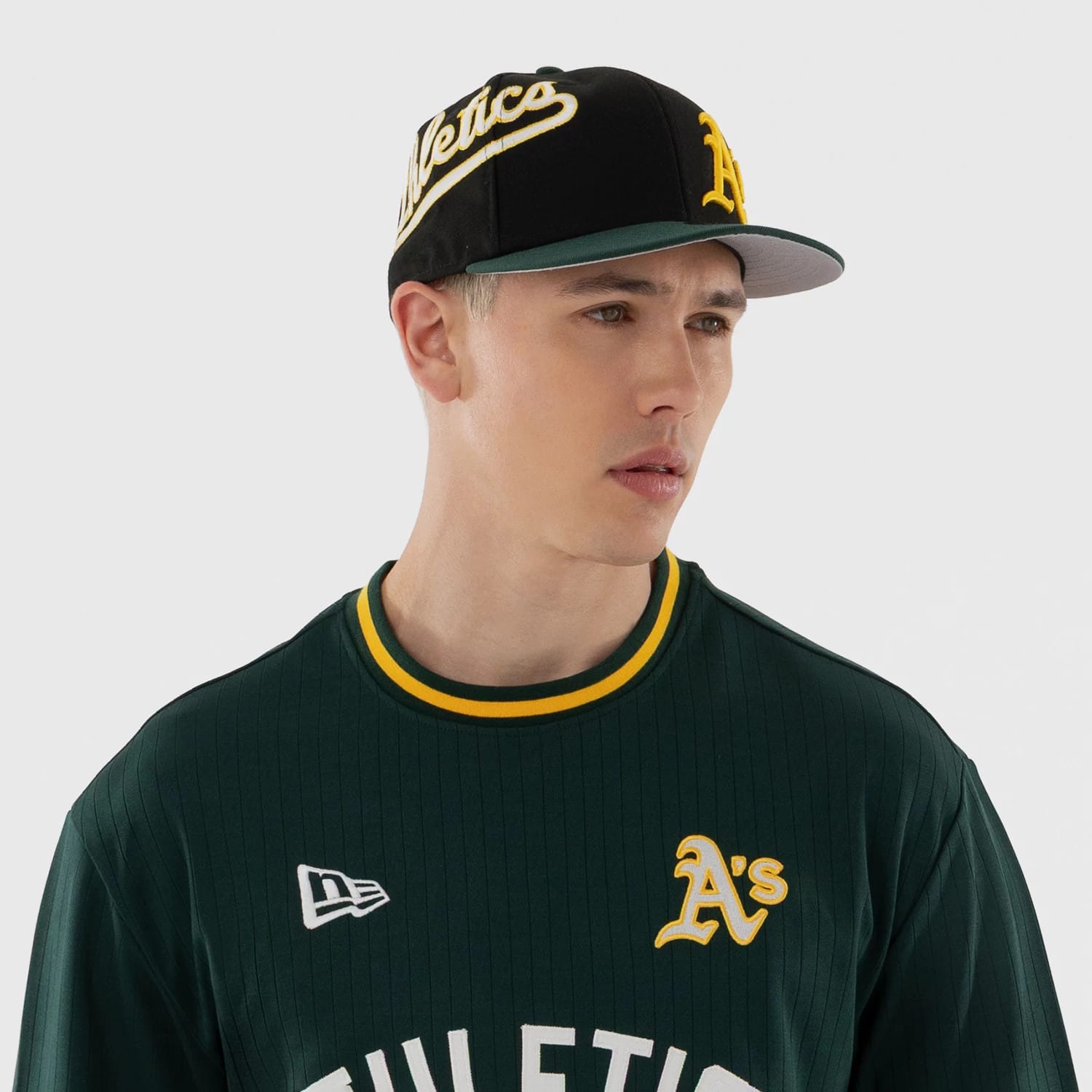 The model is wearing this MLB Athletics Oversized T-Shirt in dark green. 3