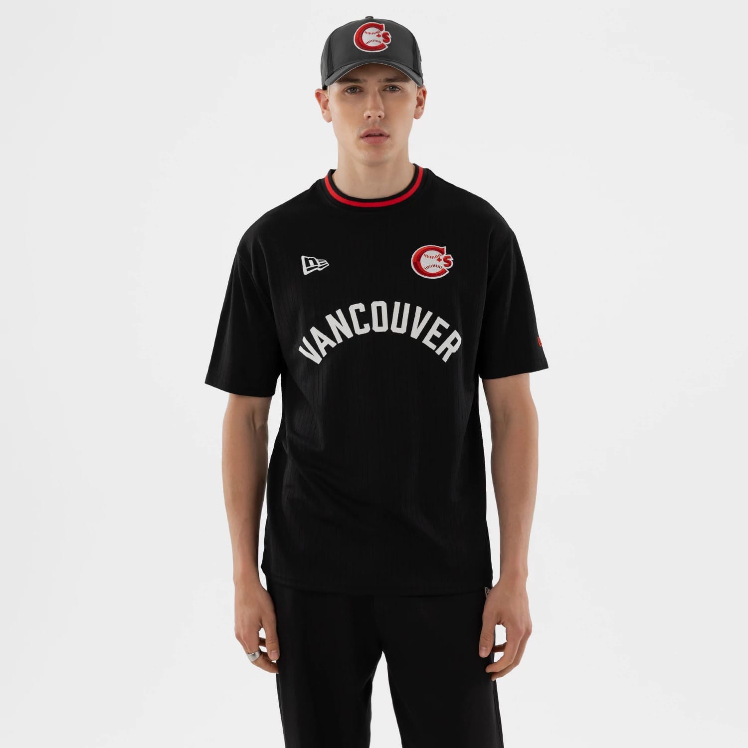 The model is wearing this MiLB Vancouver Canadians Oversized T-Shirt in black. 1