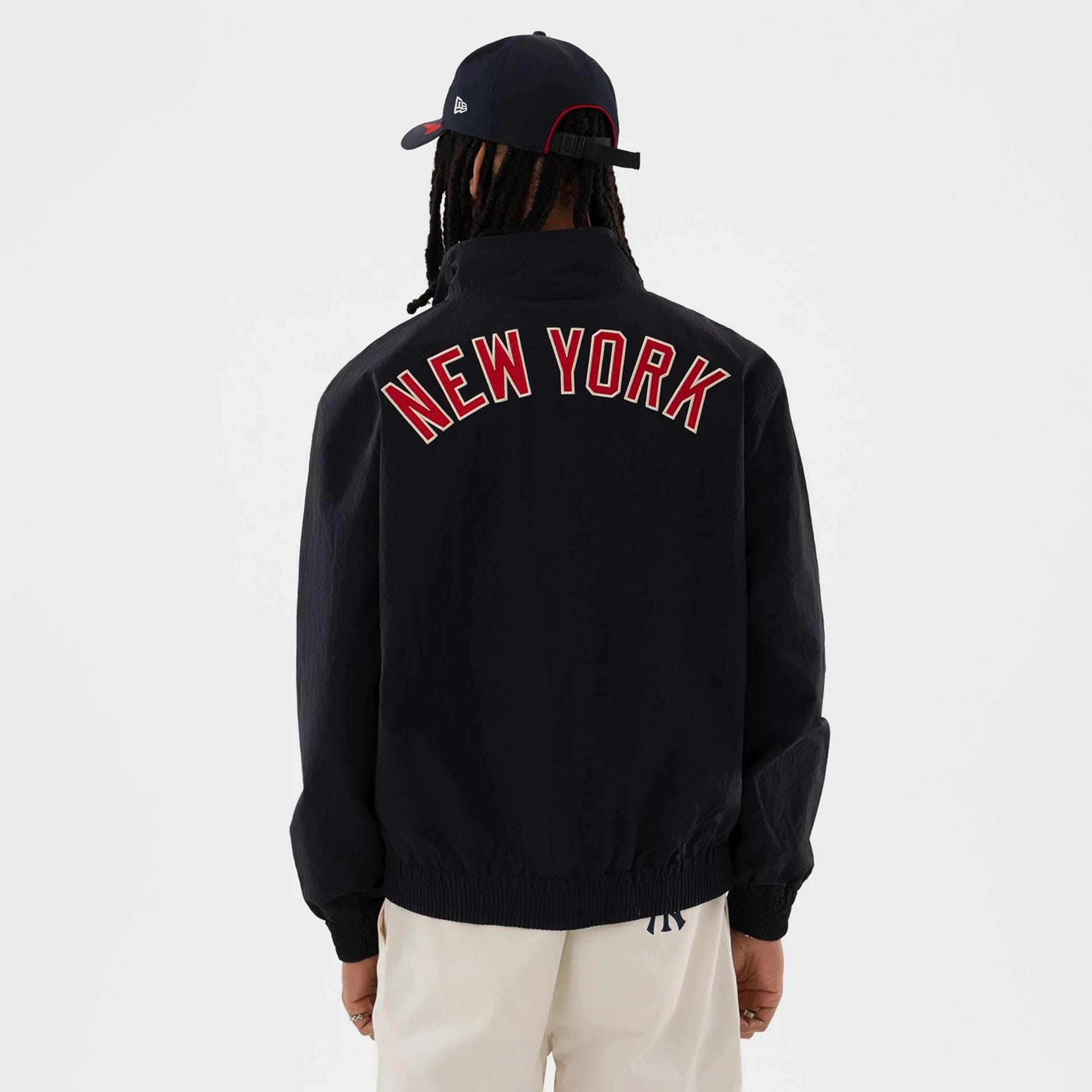 The model is wearing this MLB New York Yankees Sports Jacket in navy. 2