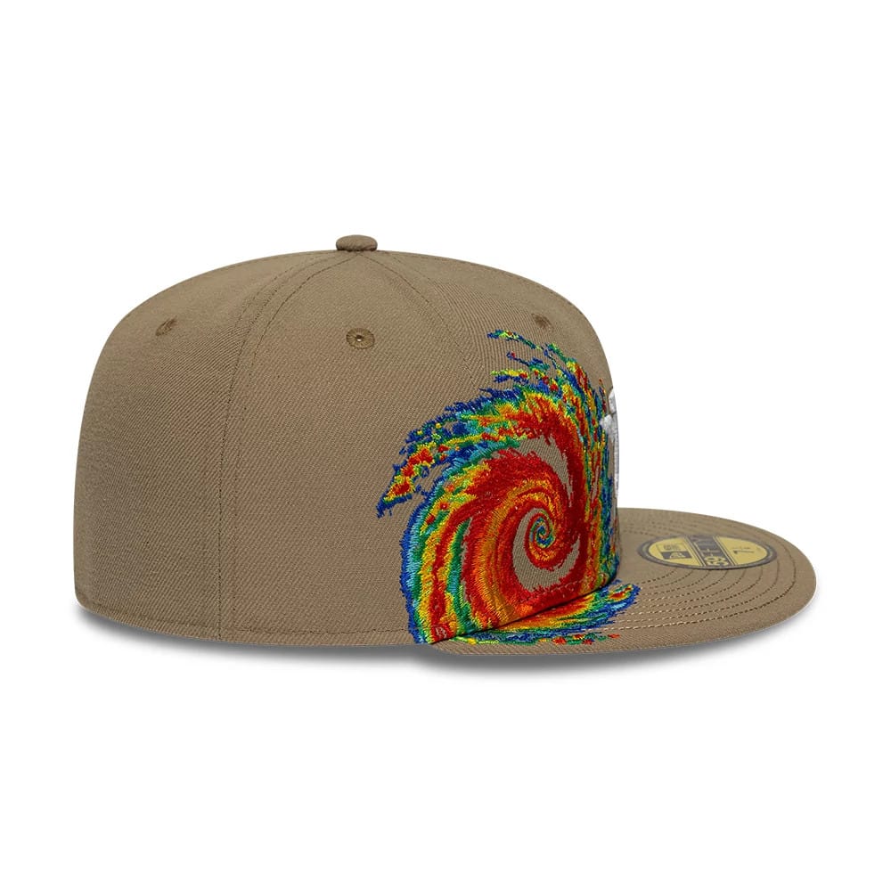 Houston Astros MLB Storm Pattern Beige New Era 59FIFTY Fitted Cap, side view showing a multicoloured storm pattern embroidered across the side and front panel, with a flat beige visor and a gold 59FIFTY size sticker on the top.