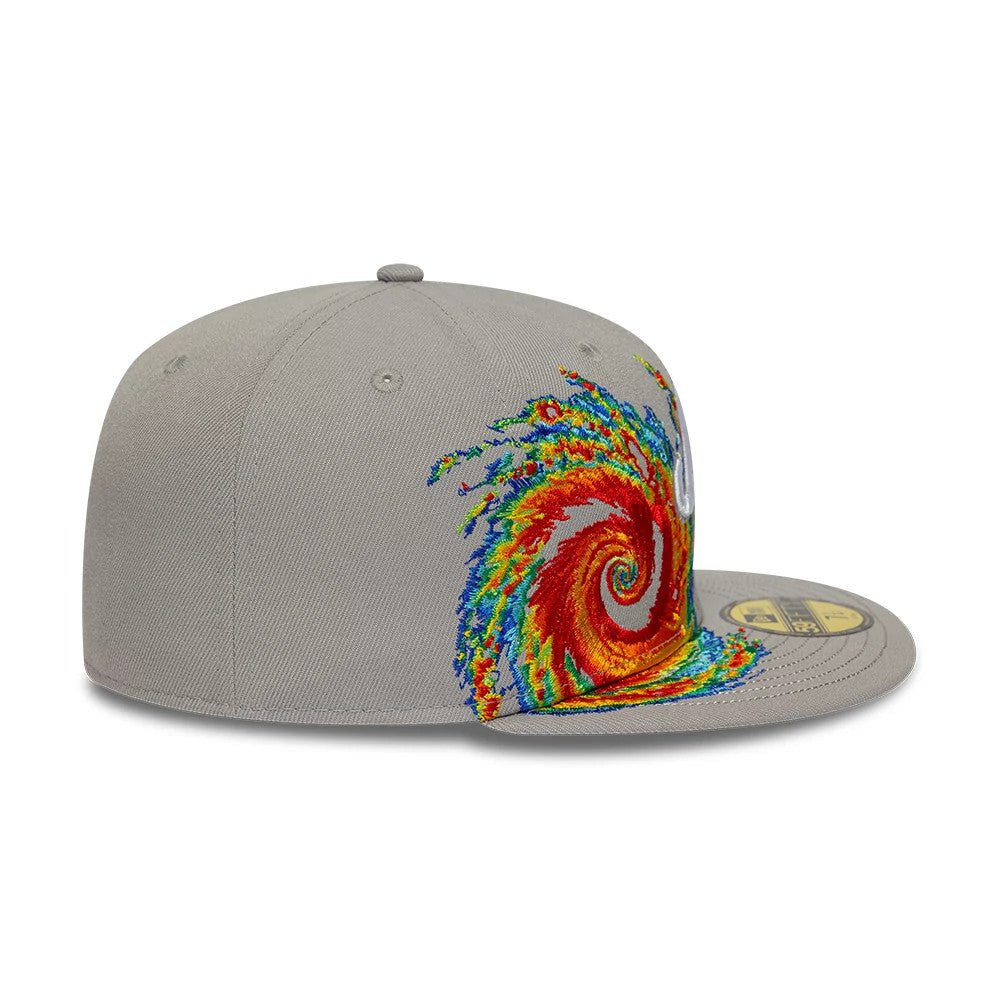 New Era Storm Pattern Grey 59FIFTY Fitted Cap, side view showing a multicoloured storm embroidery across the crown, with a structured grey crown featuring eyelets, a grey flat visor, and a gold 59FIFTY size sticker on the visor.