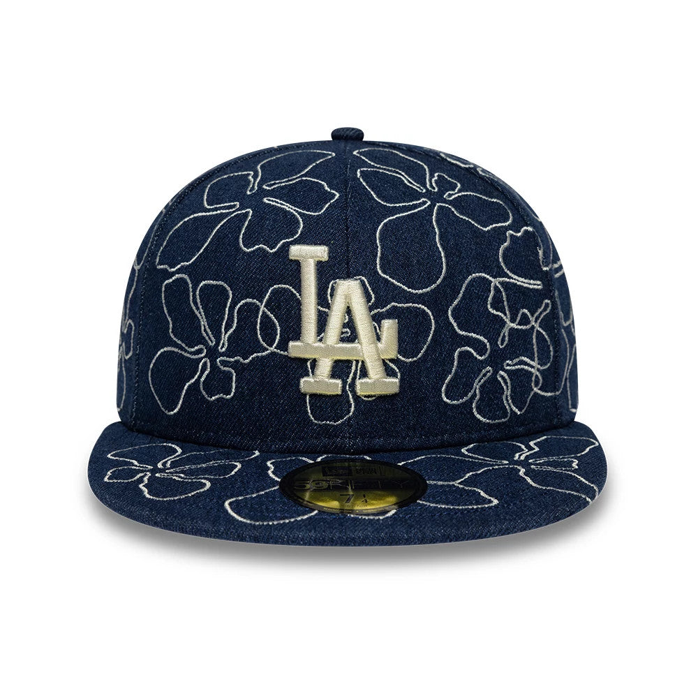 LA Dodgers MLB Floral Denim Blue New Era 59FIFTY Fitted Cap, front view showing a cream embroidered LA logo on the floral-patterned denim crown, with a matching floral visor and a gold 59FIFTY size sticker on the underside of the visor.