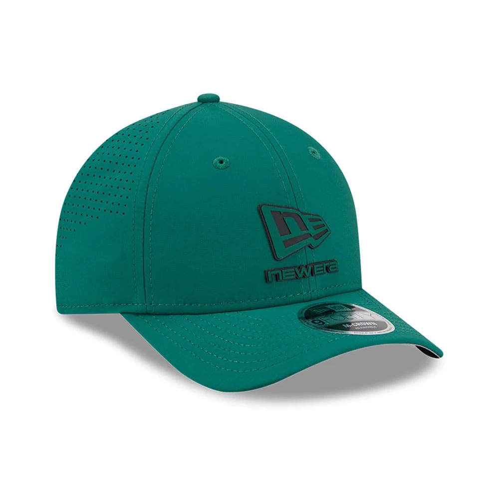 New Era Golf Green 9FORTY M-Crown Adjustable Cap, three-quarter view showing a black New Era flag logo on the front panel, a green design on the side, and a curved visor with a 9FORTY size sticker on top.