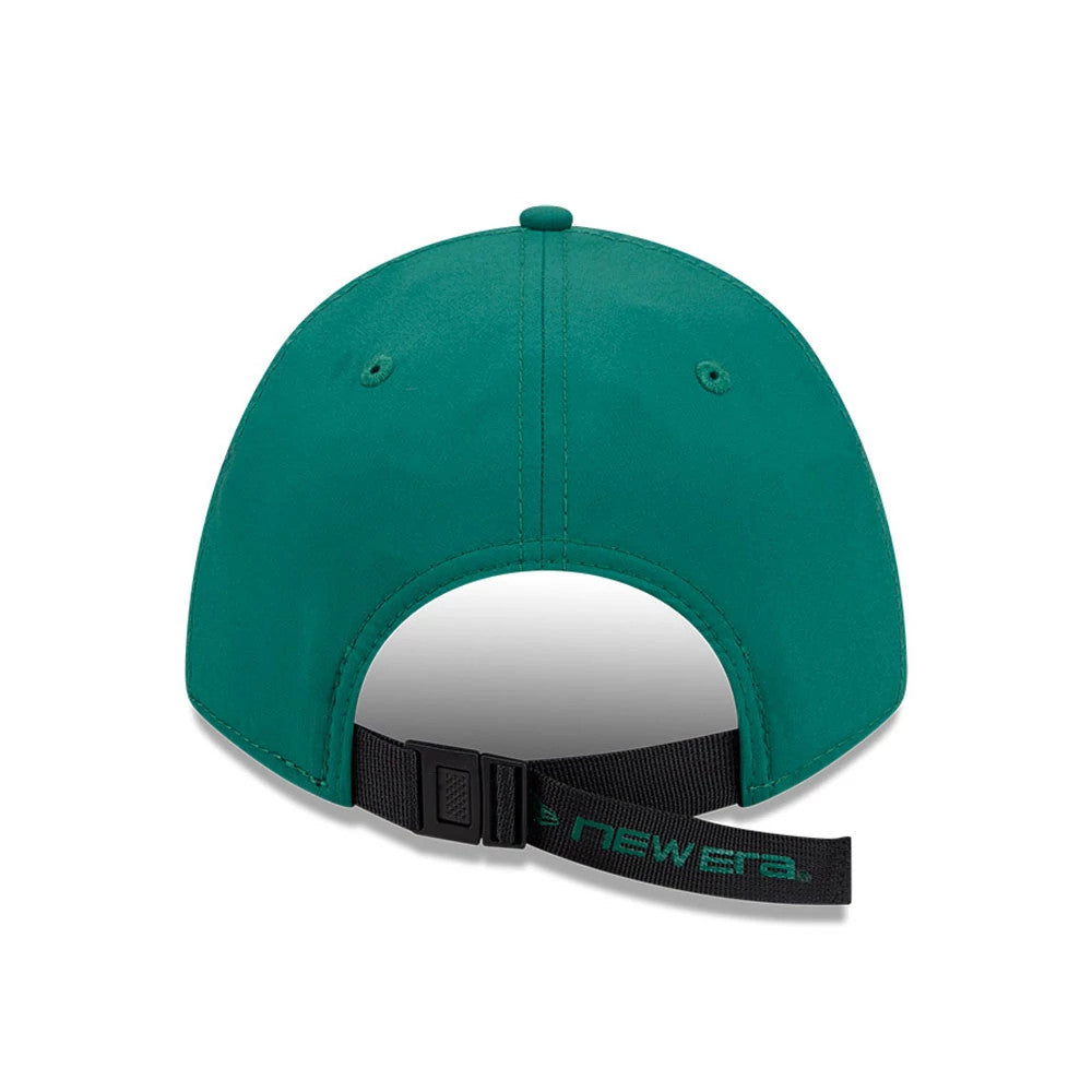 New Era Golf Green 9FORTY M-Crown Adjustable Cap, rear view showing the structured green crown with matching eyelets, black adjustable strap featuring a green embroidered New Era logo, and a top button all in coordinating green shade.