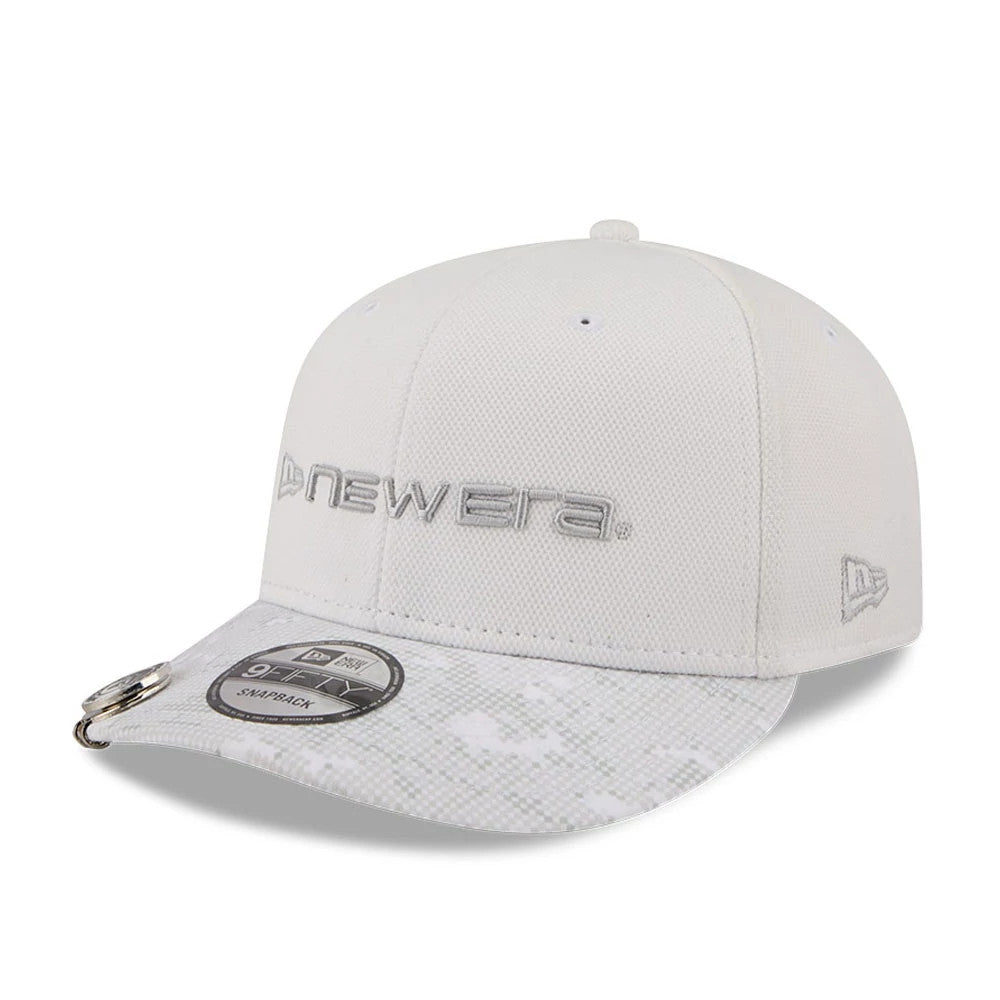 New Era Golf White New Era 9FIFTY Snapback Adjustable Cap, three-quarter view showing raised grey New Era embroidery on the front panel, a camo-patterned curved visor with a 9FIFTY size sticker, and the New Era flag logo on the left side.