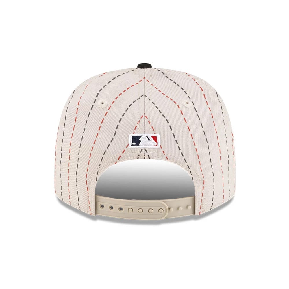 Pictured is this MLB Mexico City Series 2026 MLB Dueling League Logos 9SEVENTY Stretch Snap Adjustable cap in light beige. 7