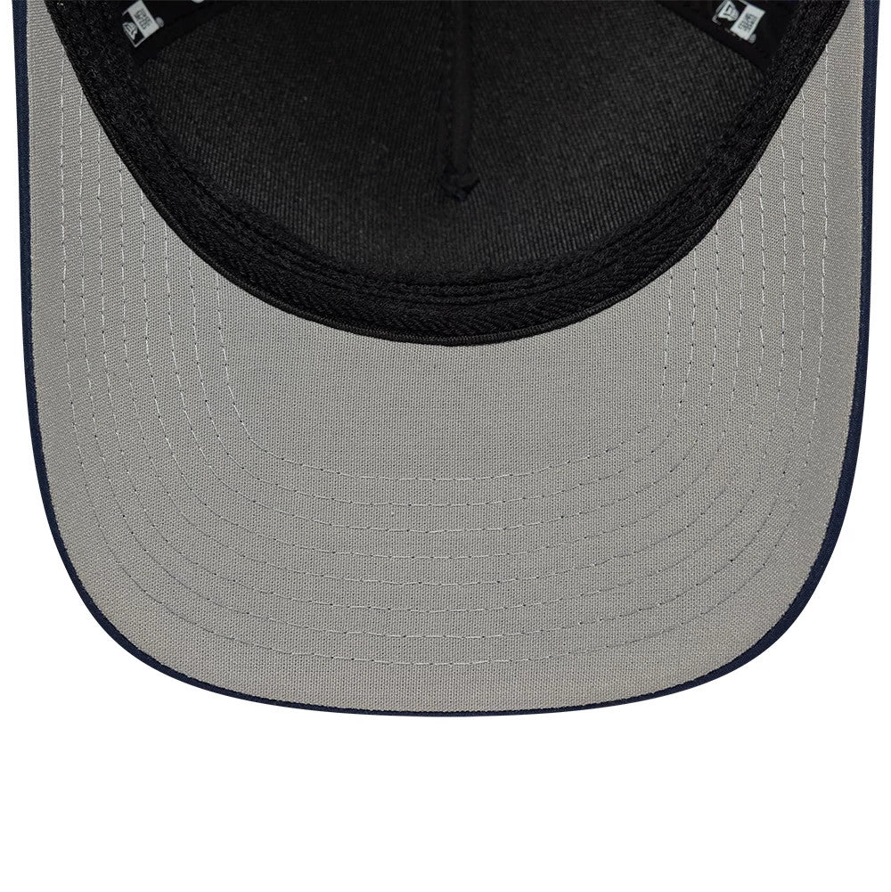 New Era Rubber Patch Dark Blue 39THIRTY M-Crown A-Frame Stretch Fit Cap, inside view showing a grey undervisor with detailed stitch lines, a black sweatband, and New Era branded taping along the interior seams.