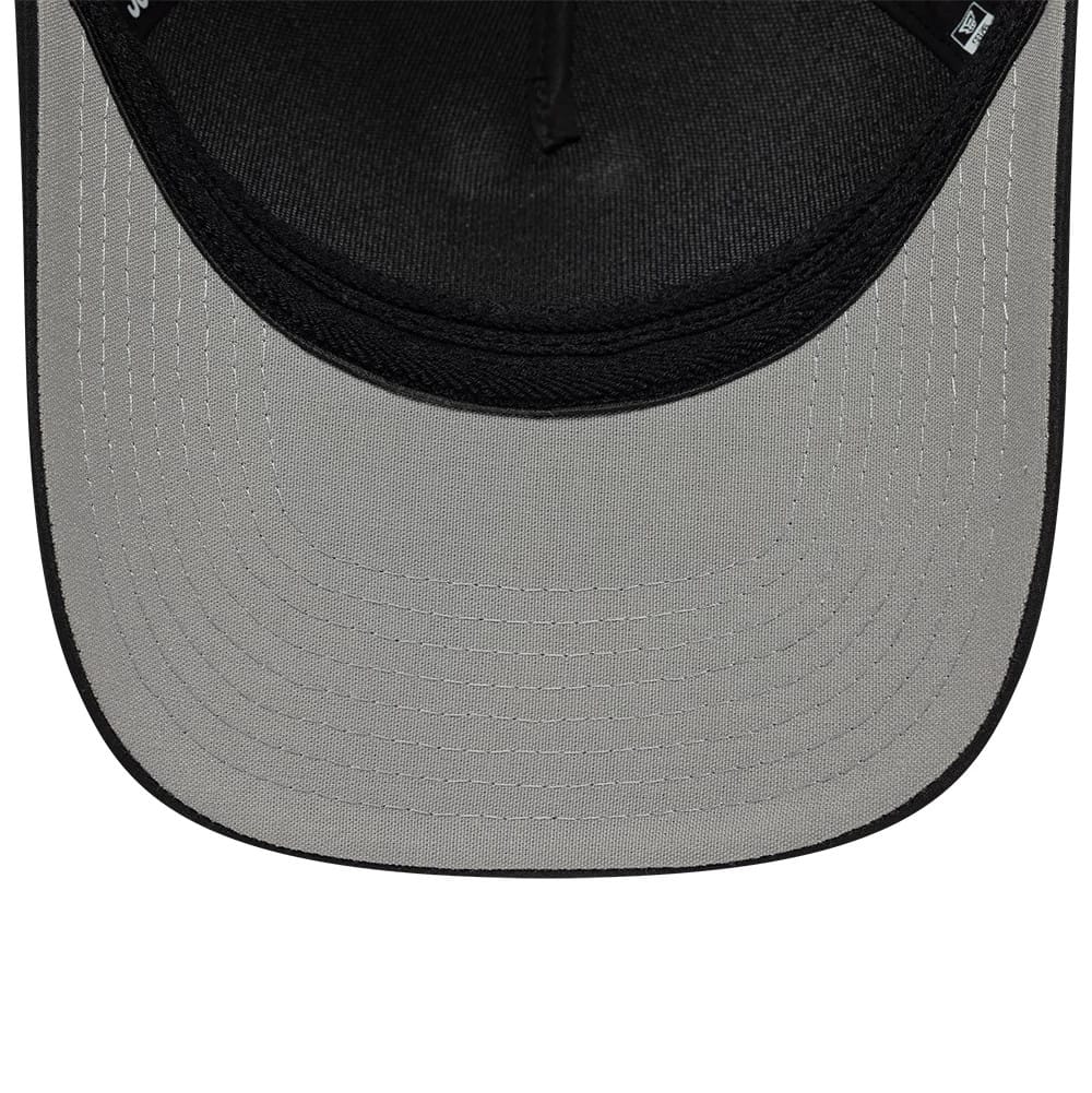 New Era Rubber Patch Black 39THIRTY M-Crown A-Frame Stretch Fit Cap, inside view showing a grey undervisor with detailed stitching, a black sweatband lining the edge, and New Era taping along the seams of the black interior.