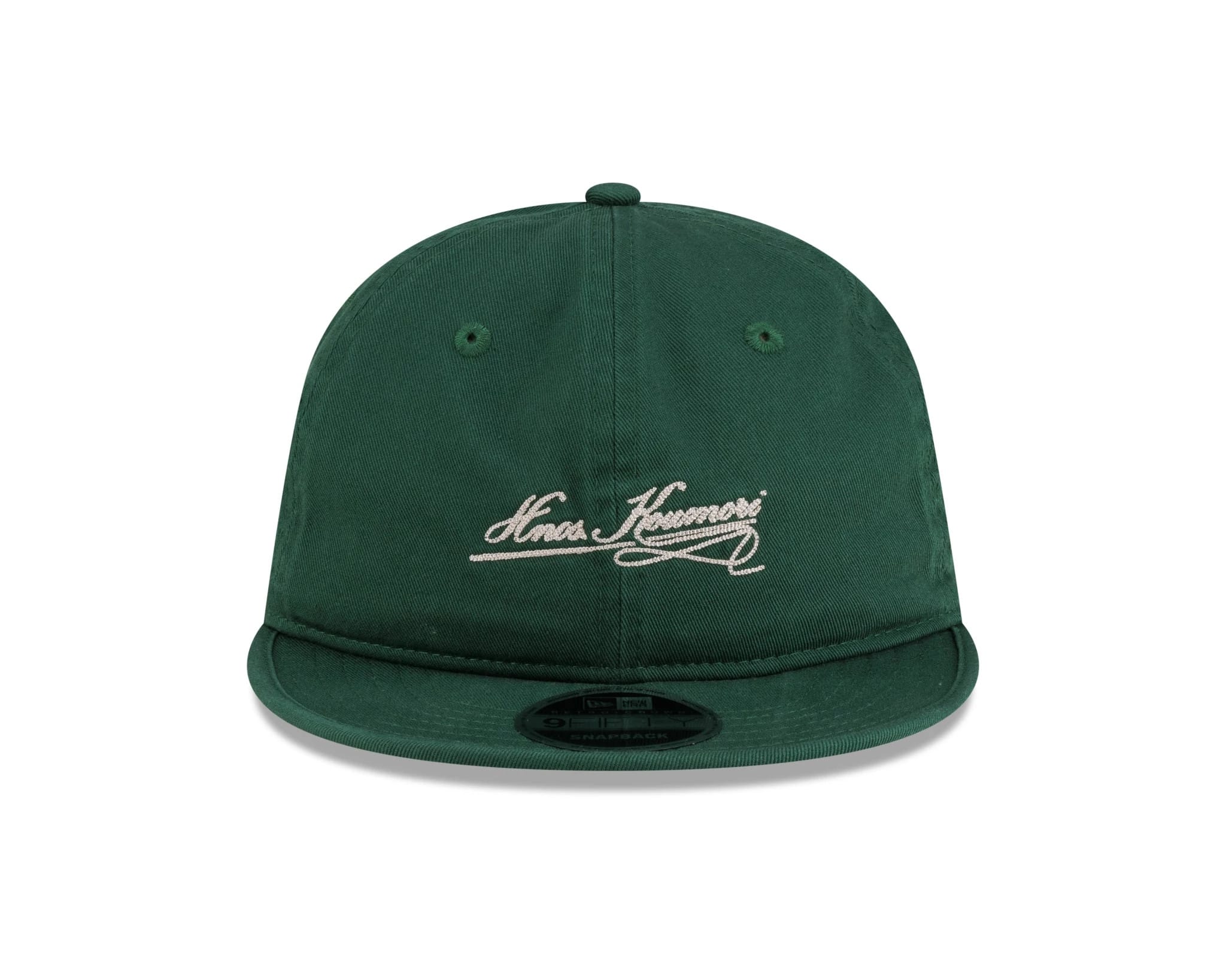 New Era X Hermanos Koumori Cursive Green Retro Crown 9FIFTY Adjustable Cap, front view showing the white cursive embroidered Hermanos Koumori logo on the structured green crown, with a flat green visor and 9FIFTY size sticker.