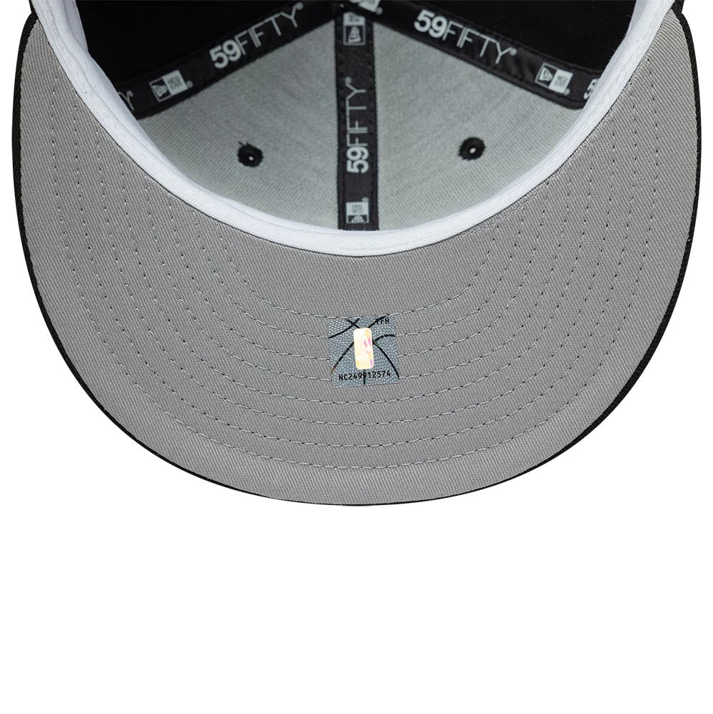 Toronto Raptors NBA Hardwood Classic Black New Era 59FIFTY Fitted Cap, inside view showing the grey undervisor with a holographic sticker at the centre, surrounded by black 59FIFTY taping and a white sweatband along the edge.