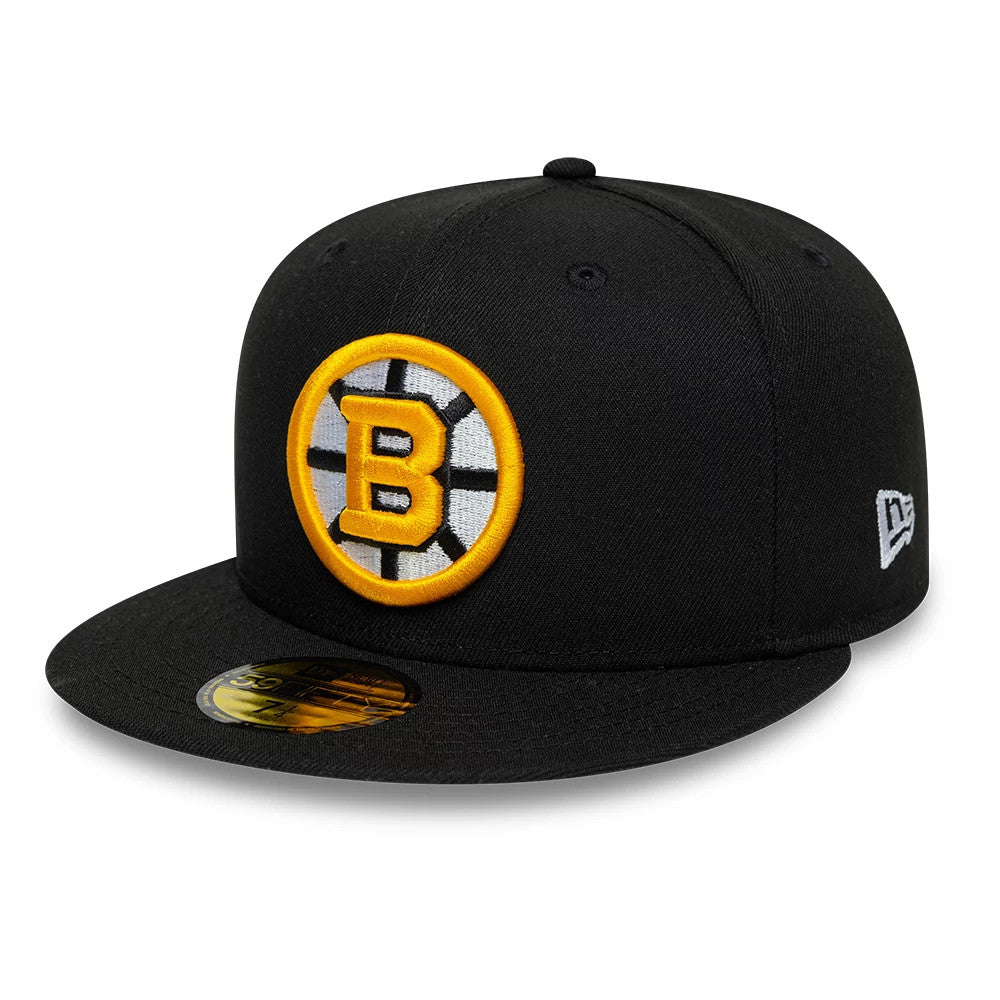 Boston Bruins NHL Basic Black New Era 59FIFTY Fitted Cap, three-quarter view showing a raised embroidered yellow and black Bruins logo on the front panel, with a flat black visor featuring a gold 59FIFTY size sticker.