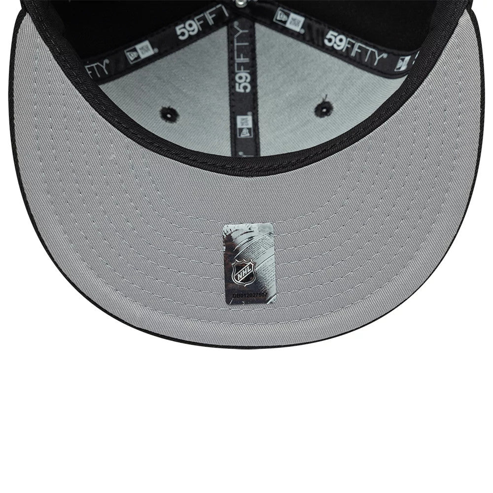 Boston Bruins NHL Basic Black New Era 59FIFTY Fitted Cap, inside view showing grey undervisor with NHL sticker, black interior taping featuring the 59FIFTY logo, and a black sweatband near the base of the structured crown.