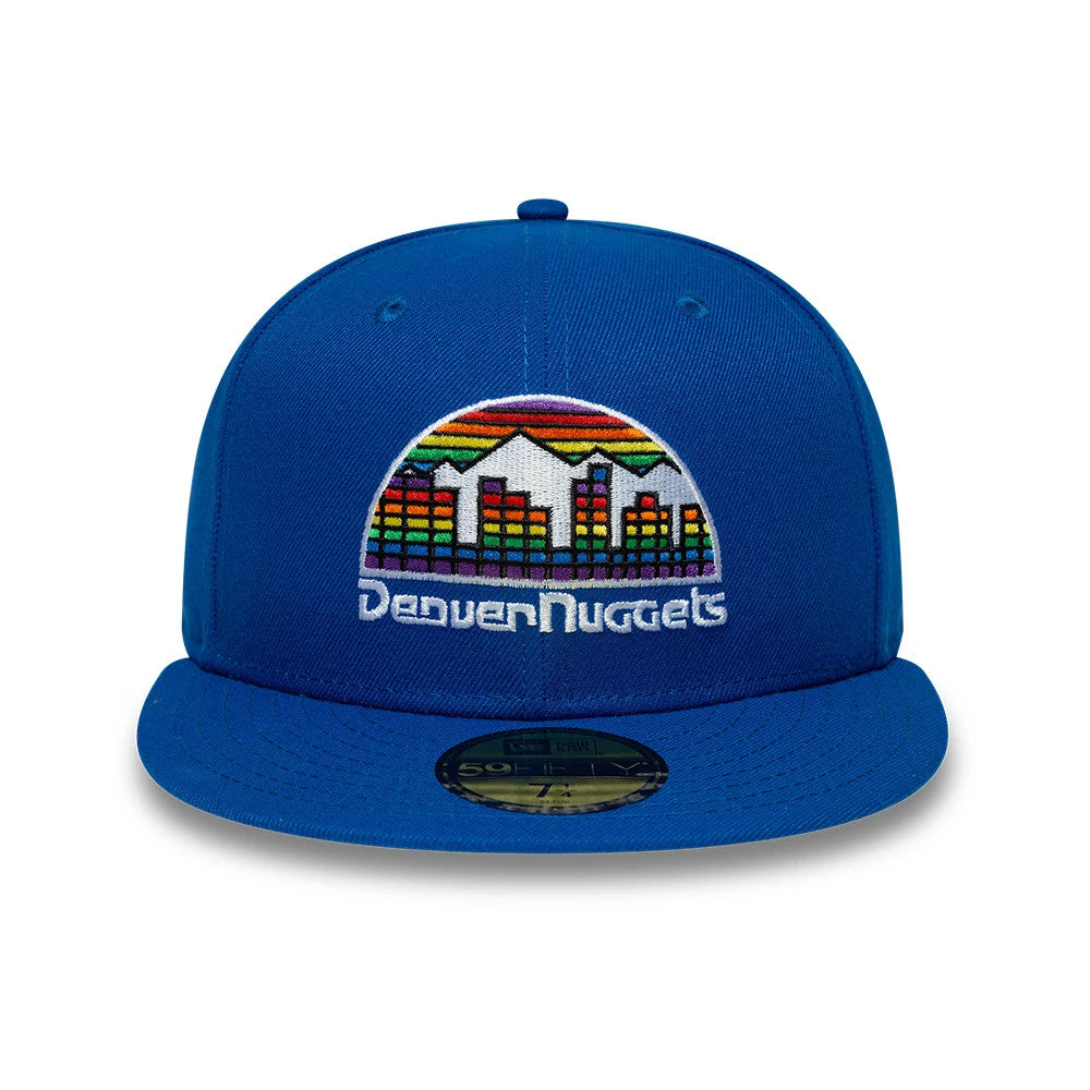 Denver Nuggets NBA Hardwood Classic Blue New Era 59FIFTY Fitted Cap, front view showing a colourful embroidered retro skyline logo on the structured blue front panels, paired with a flat blue visor featuring a gold 59FIFTY size sticker.