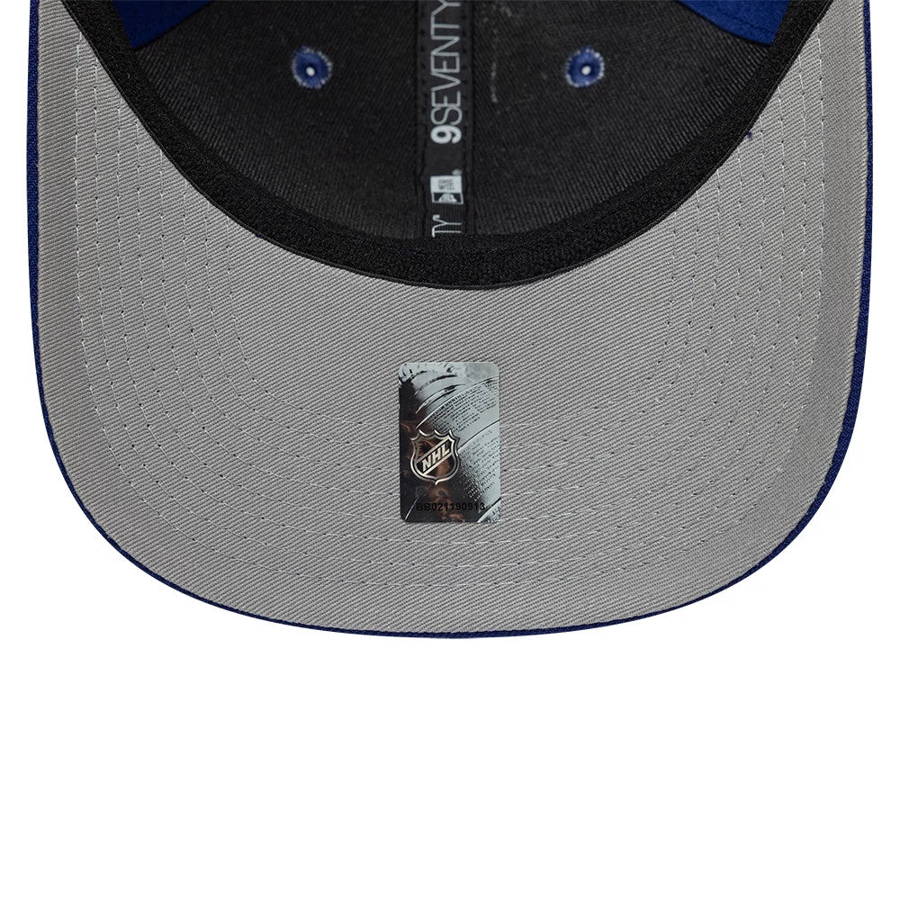 Tampa Bay Lightning NHL Team Blue New Era 9SEVENTY Stretch Snap Adjustable Cap, inside view with a grey undervisor featuring the NHL logo sticker, black sweatband, and branded taping running across the inner panels.