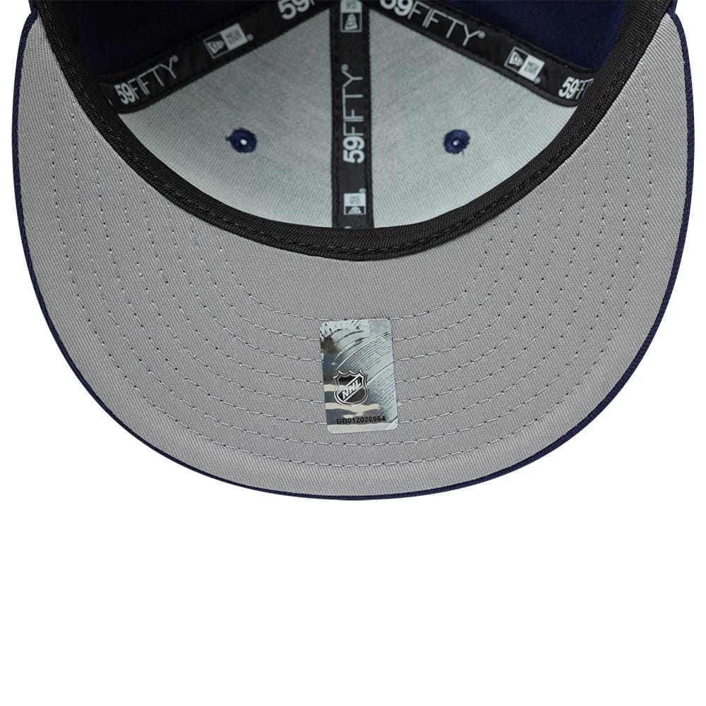 Pictured is this NHL Basic Toronto Maple Leafs 59FIFTY Fitted cap in navy. 2