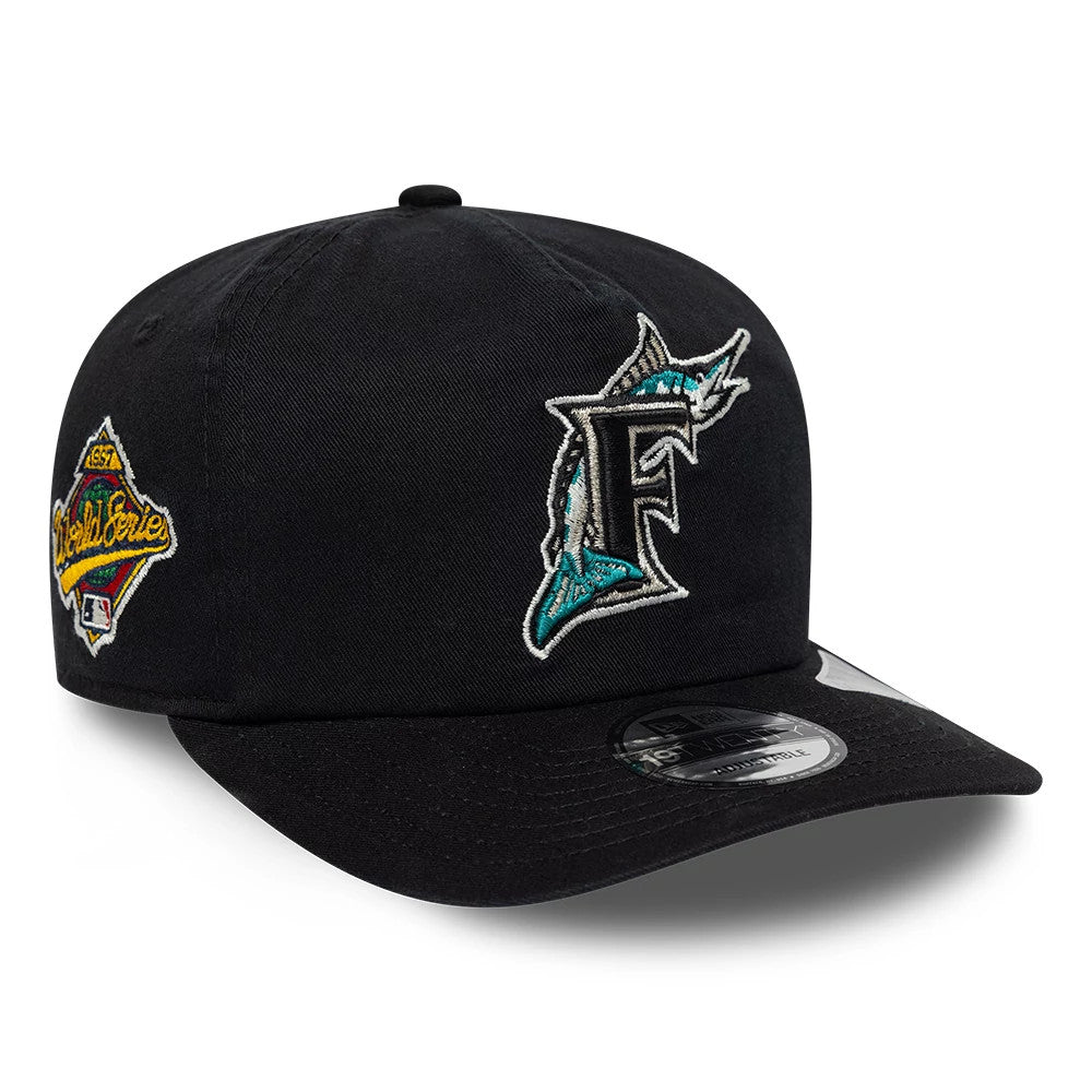 Miami Marlins MLB Championship Black New Era 19TWENTY Adjustable Cap, three-quarter view showing the front panel with an embroidered teal and white Marlins logo, a World Series side patch on the left panel.