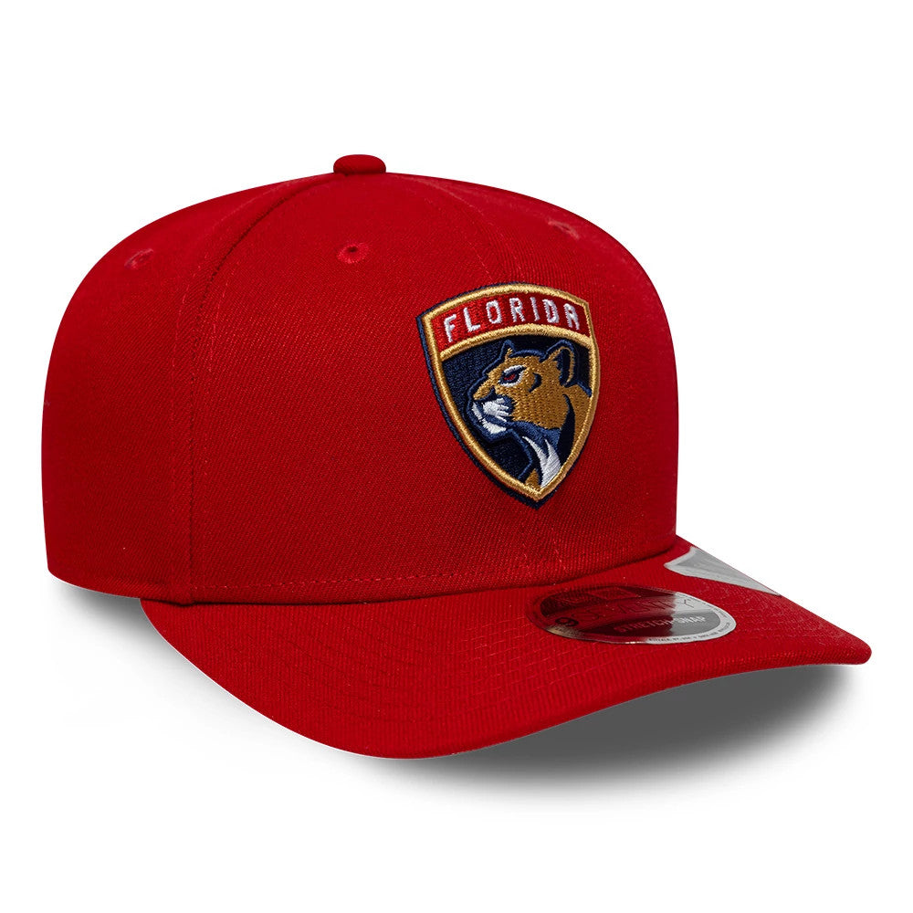 Florida Panthers NHL Team Red New Era 9SEVENTY Stretch Snap Adjustable Cap, front view showing the raised embroidered Panther logo on the front panel, a pre-curved red visor, and a 9SEVENTY size sticker positioned on the visor’s top.
