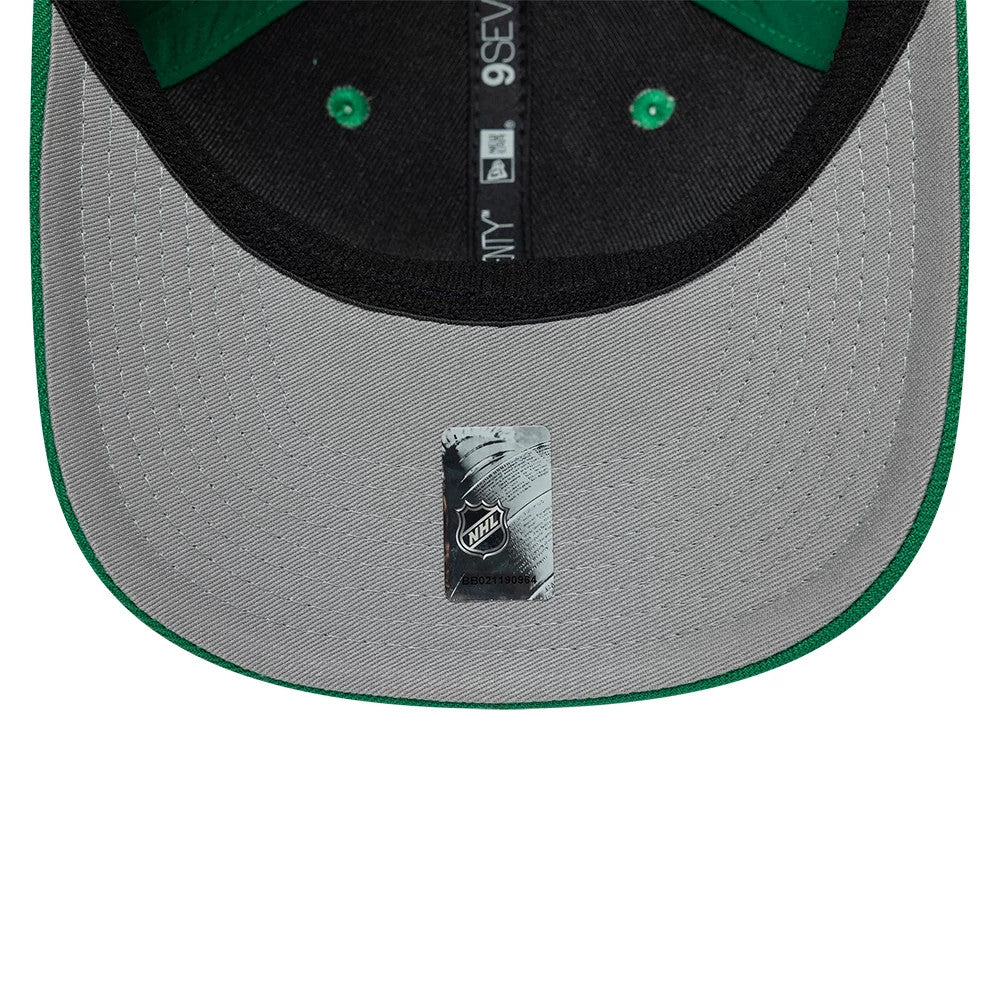 Dallas Stars NHL Team Green New Era 9SEVENTY Stretch Snap Adjustable Cap, inside view showing the grey undervisor with an NHL sticker, black sweatband with branding, and green taping inside the crown.