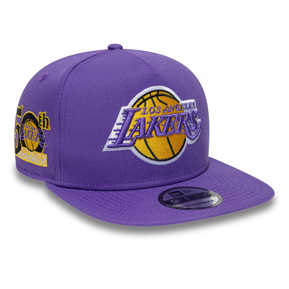LA Lakers NBA Hardwood Classic Purple New Era 9FIFTY A-Frame Snapback Adjustable Cap, front view showing the raised embroidered Lakers logo in yellow, purple, and white on the front panel, with side embroidery.