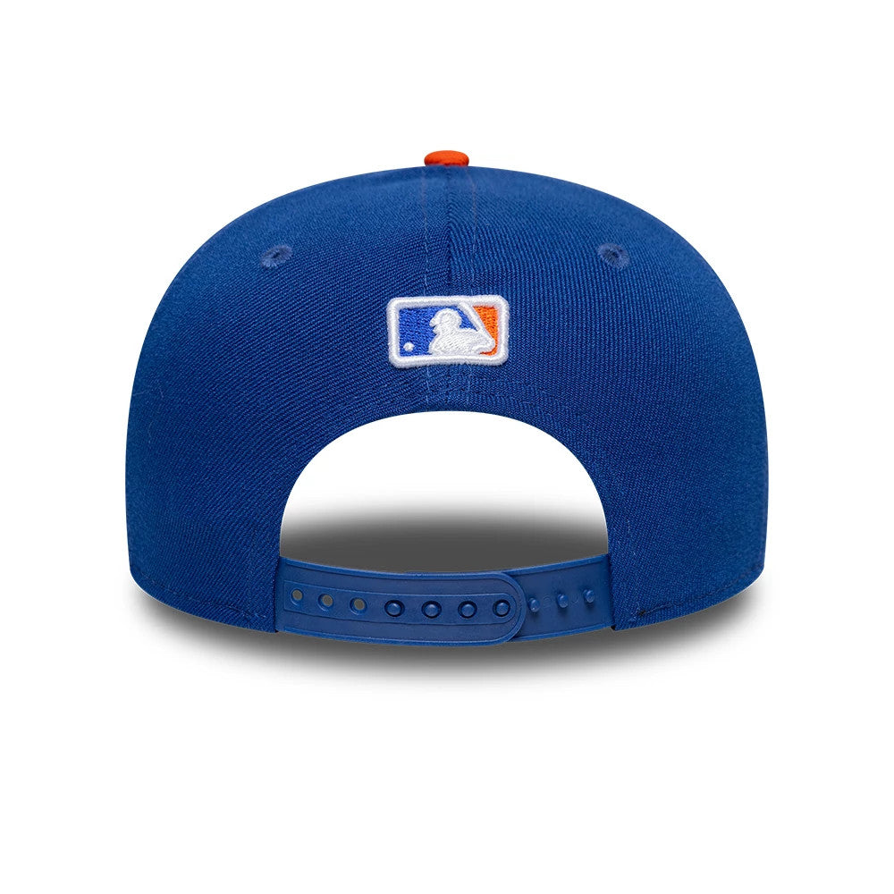 New York Mets MLB Player Replica Blue New Era 9SEVENTY Stretch Snap Adjustable Cap, rear view showing the white and orange embroidered MLB Batterman logo at the centre of the back panels, with a blue adjustable snap closure and an orange top button.