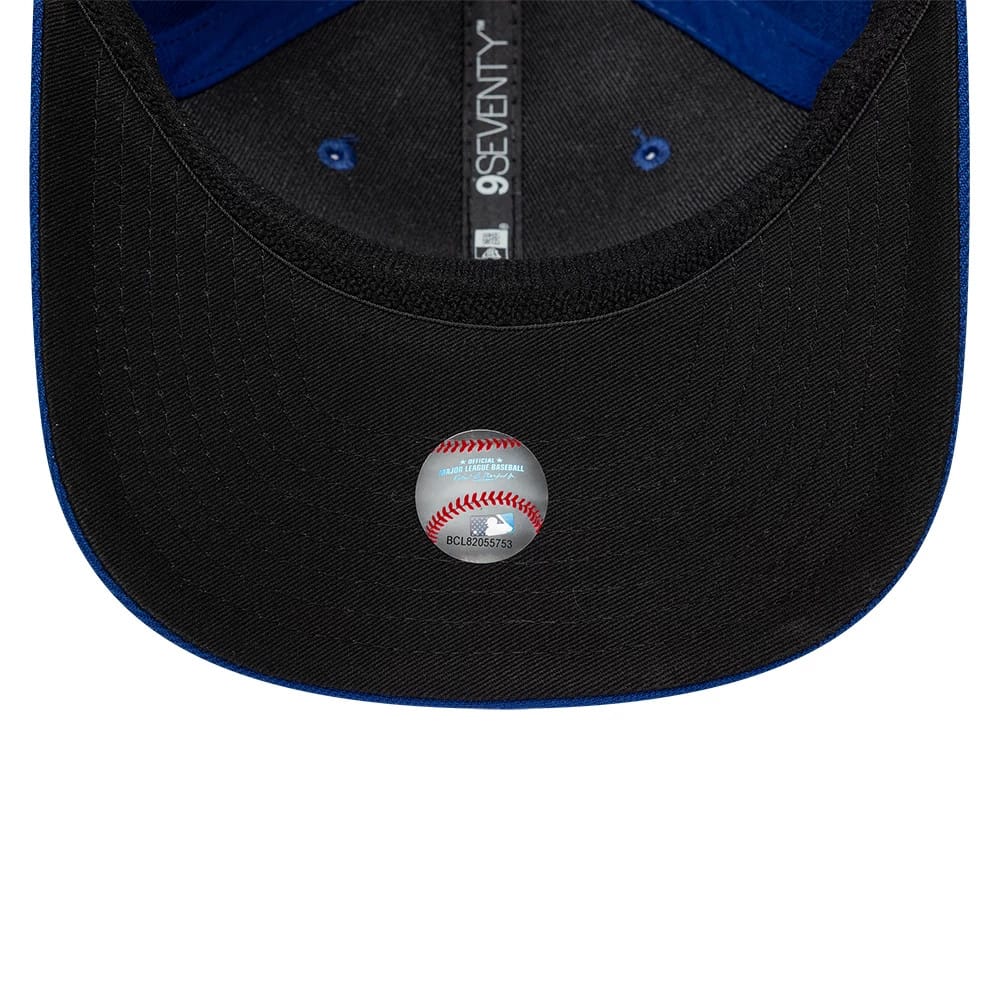 New York Mets MLB Player Replica Blue New Era 9SEVENTY Stretch Snap Adjustable Cap, inside view showing black undervisor with a baseball-shaped sticker, contrasting blue taping and eyelets on the black fabric, and 9SEVENTY branding on the seam tape.