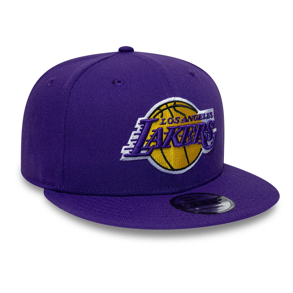 LA Lakers NBA Purple New Era 9FIFTY Snapback Adjustable Cap, front view showing a raised embroidered Lakers logo with a yellow basketball motif on the purple front panel, paired with a matching purple flat visor and a reflective 9FIFTY size sticker.