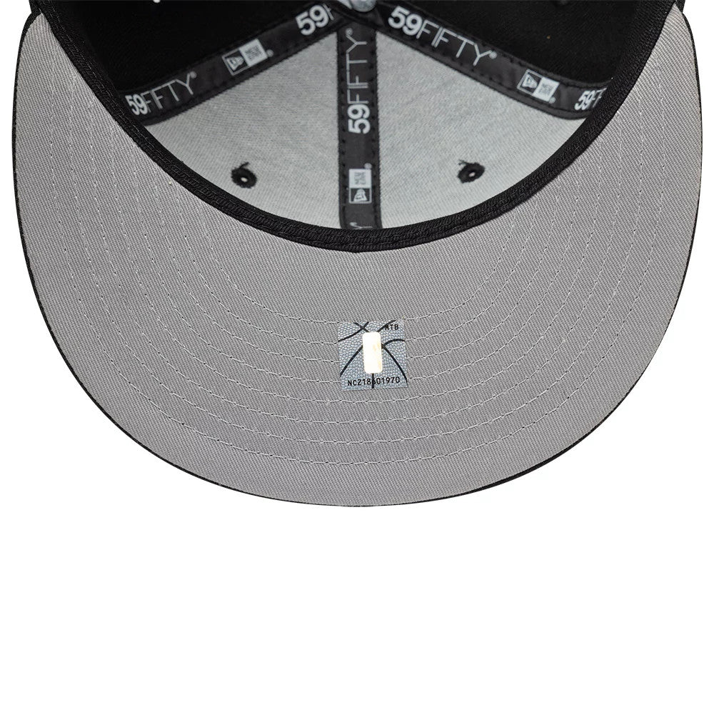 Brooklyn Nets NBA Basic Black New Era 59FIFTY Fitted Cap, inside view showing the grey undervisor, black 59FIFTY taping along the seams, and a white size sticker placed centrally beneath the geometric pattern of the cap.