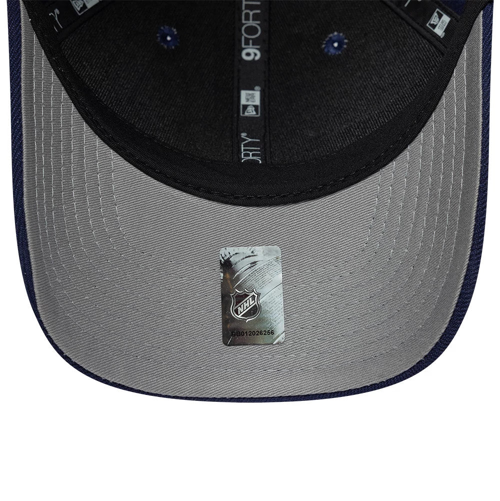 Toronto Maple Leafs NHL Team Navy New Era 9FORTY M-Crown Adjustable Cap, inside view showing the grey undervisor with an NHL logo sticker, black sweatband, and branded 9FORTY taping running across the inner crown.