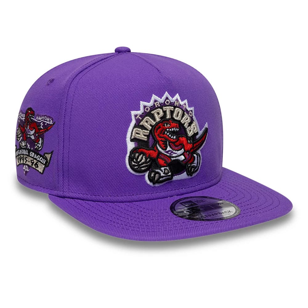 Pictured is this NBA Hardwood Classic Toronto Raptors 9FIFTY A-Frame Snapback cap in bright purple. 1