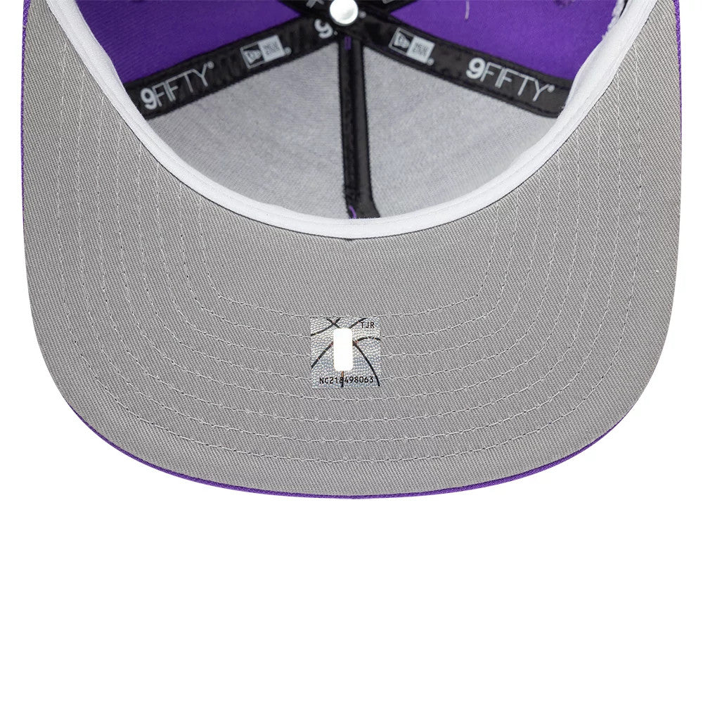 Toronto Raptors NBA Hardwood Classic Bright Purple New Era 9FIFTY A-Frame Snapback Adjustable Cap, inside view showing a grey undervisor, purple taping with New Era branding, and a white sweatband encircling the interior.
